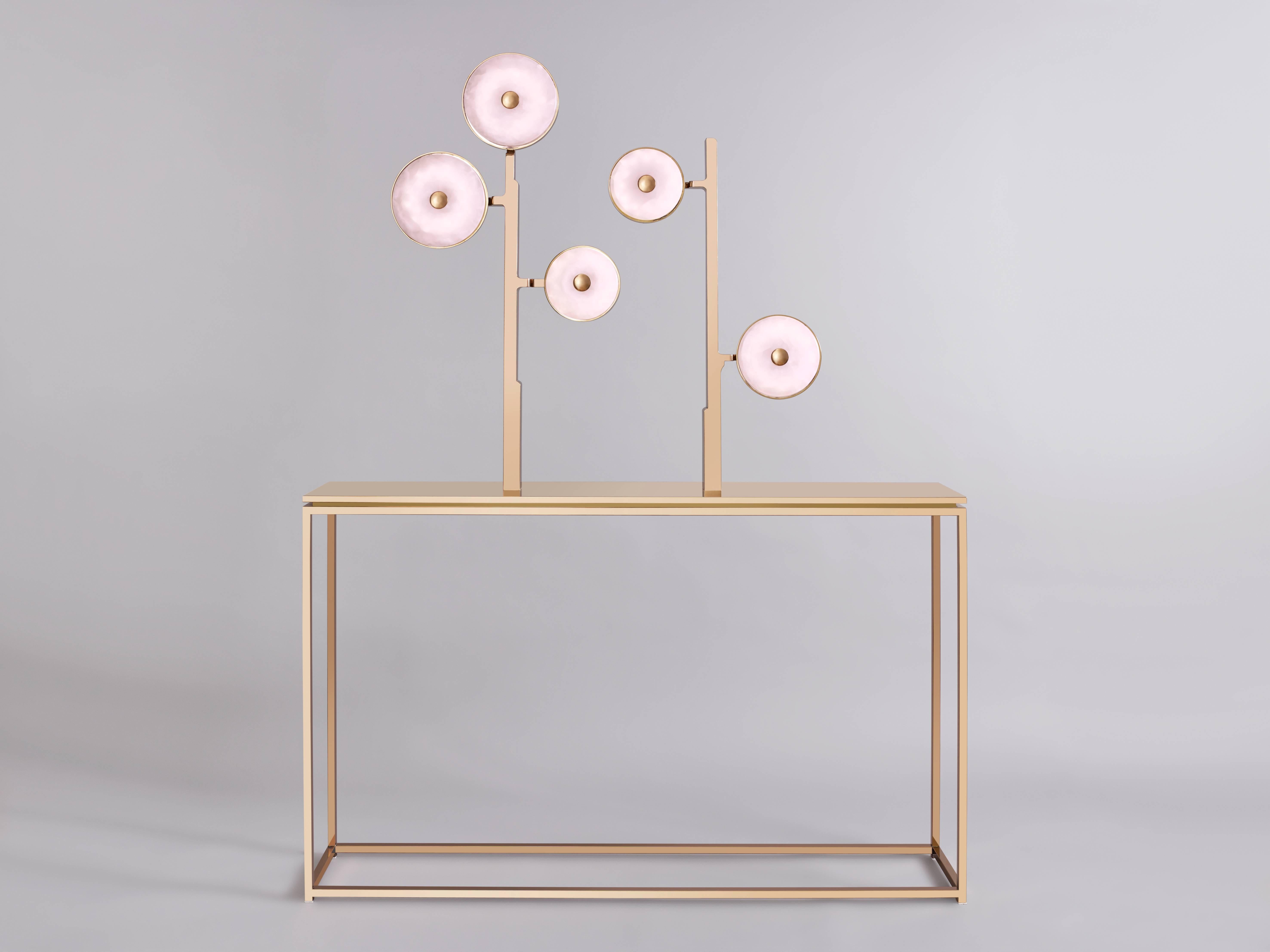 This 'JinShi Pink Jade' glamorous luminous console by acclaimed design duo Studio MVW is a true jewel for the home. It encompasses five retro-lit heads in natural pink jade, an exceptional gemstone with a sumptuous powder transparency, and a
