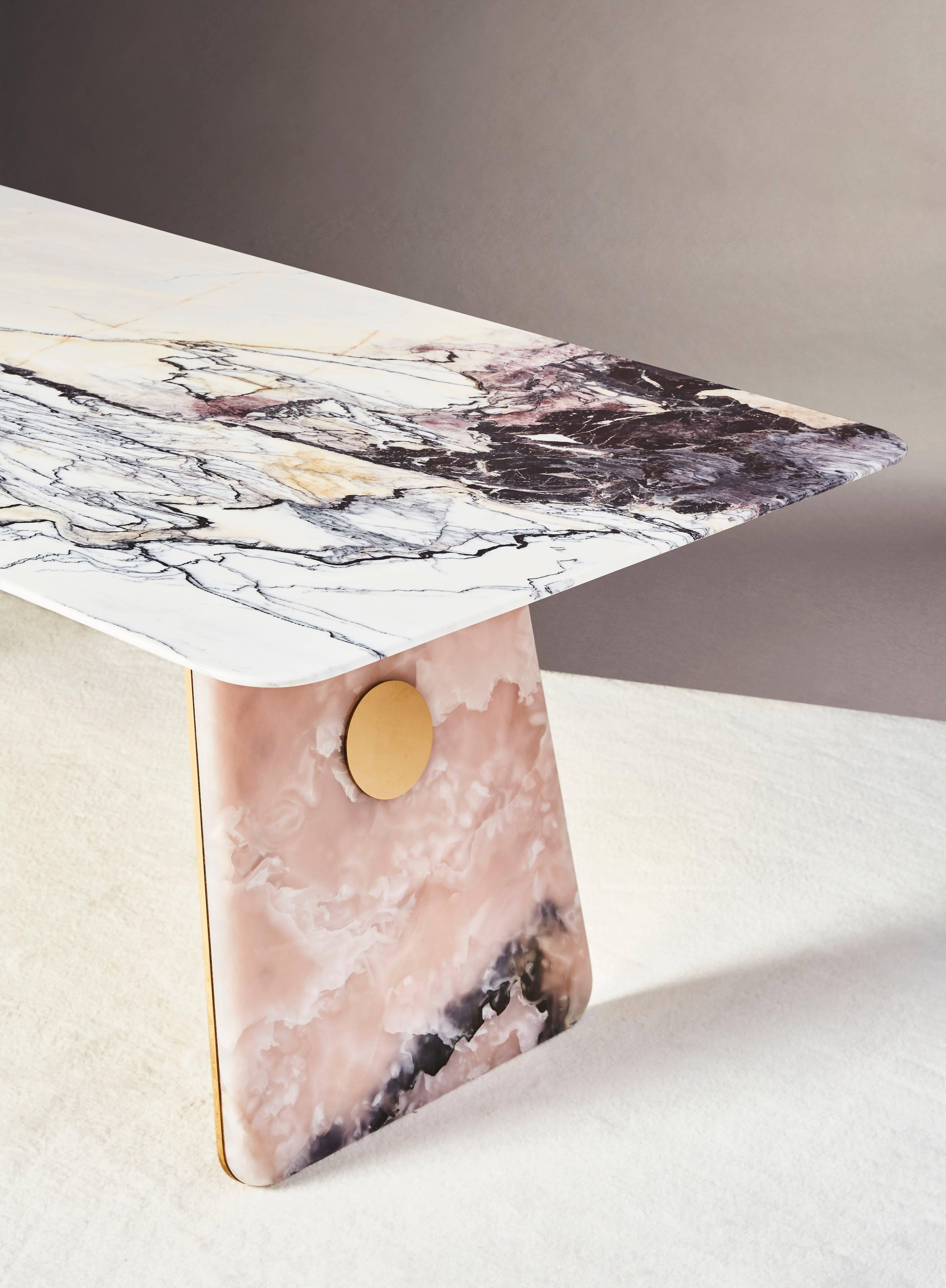 This table is a sumptuous piece of collectible design combining precious Burman marble and natural pink jade, an exceptional gemstone with a sumptuous powder transparency. The Burman marble top with its different patterns of purples, greys and