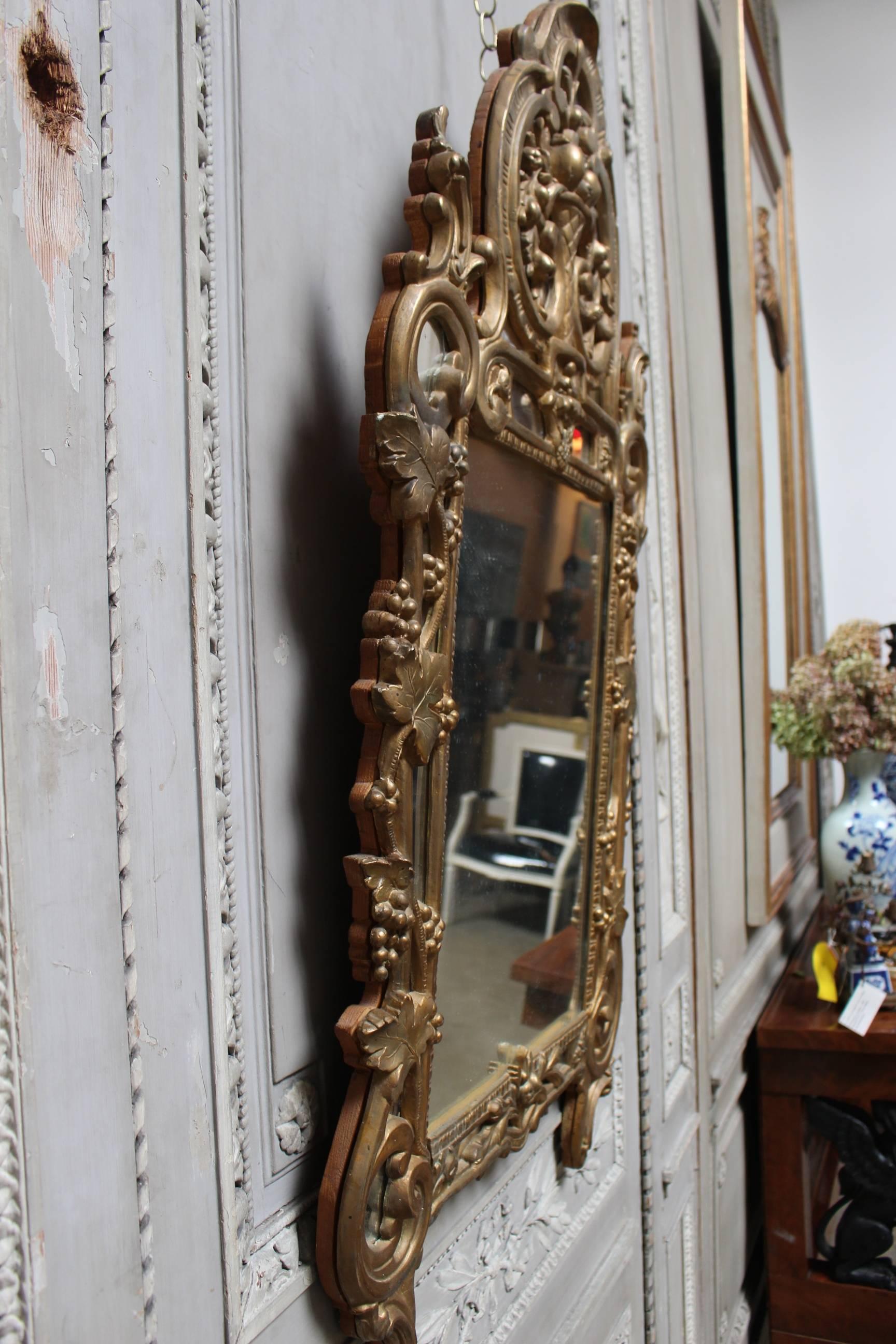 18th Century French Regence Mirror with a Gold Leaf Finish In Fair Condition For Sale In Dallas, TX
