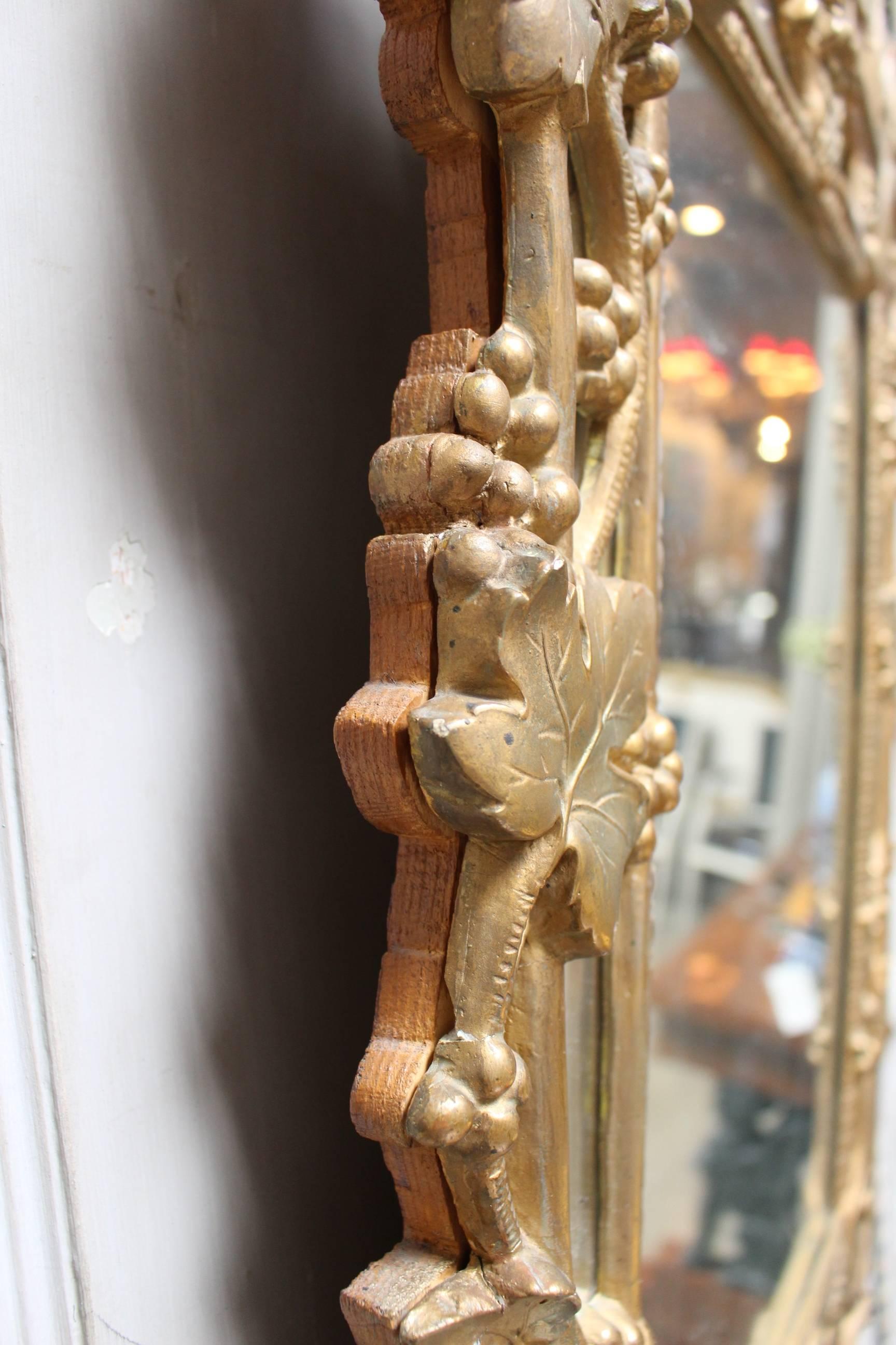 Plaster 18th Century French Regence Mirror with a Gold Leaf Finish For Sale