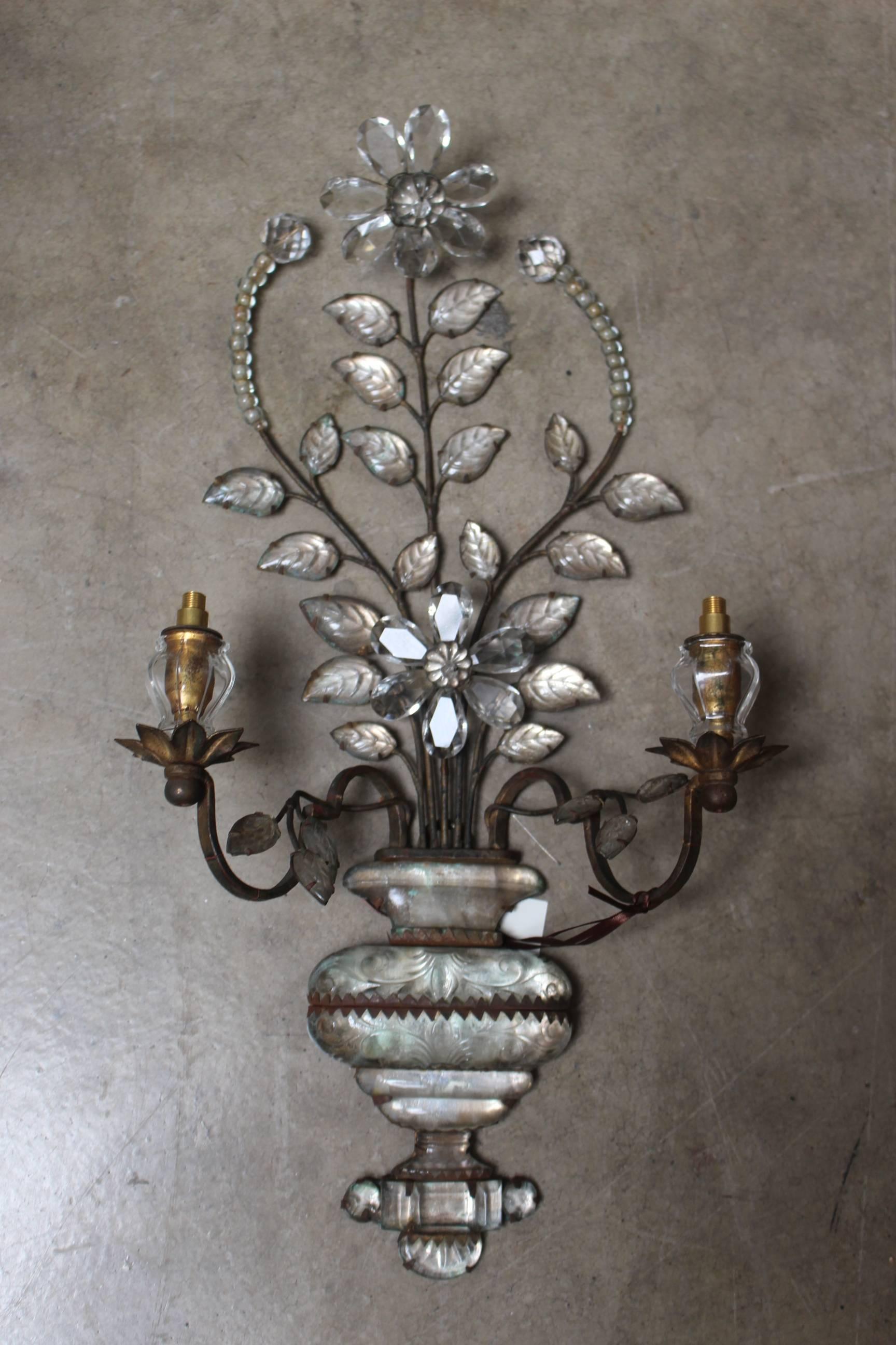 A pair of early Maison Baguès two-light crystal and metal sconces.
 