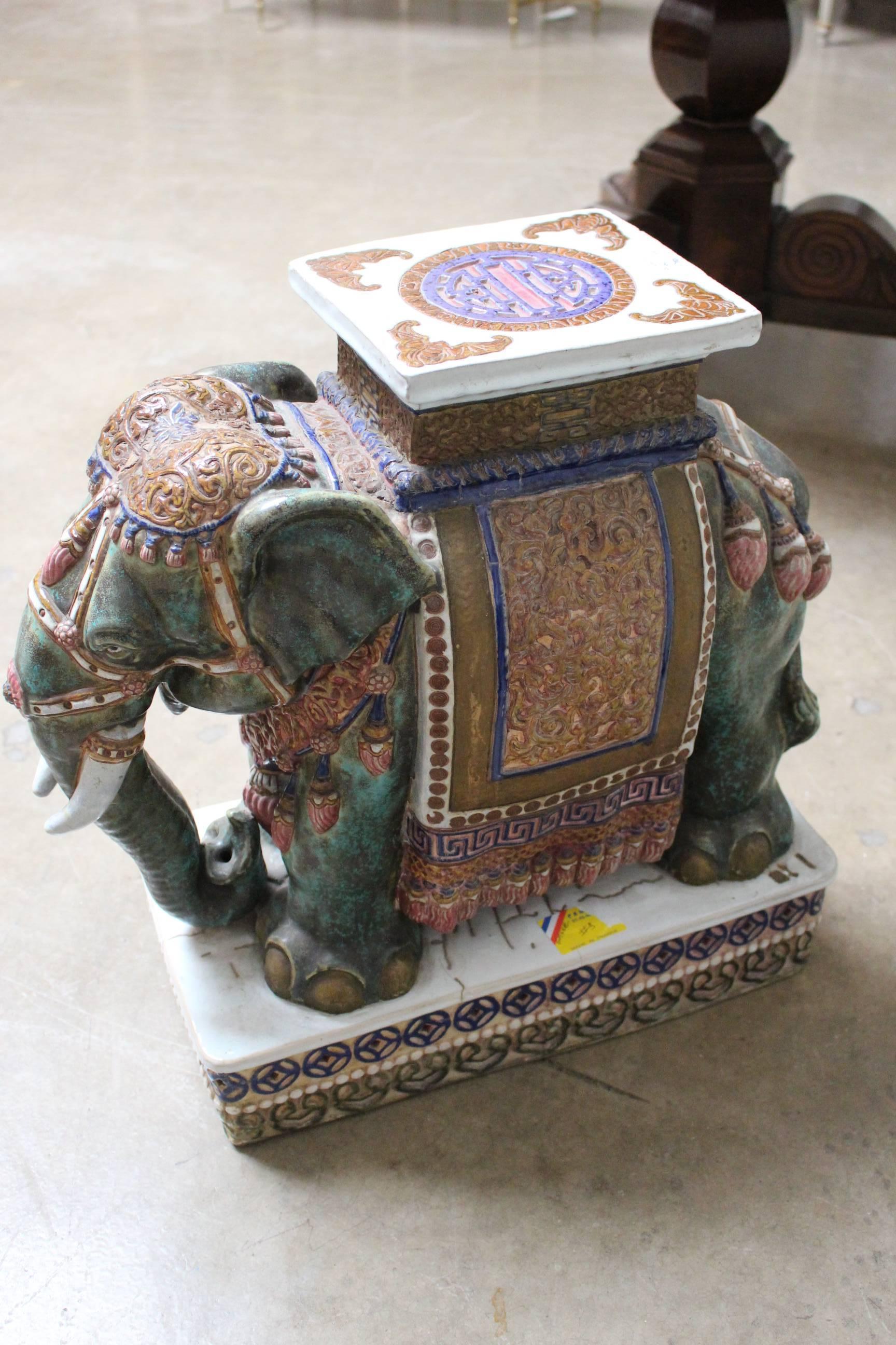A pair of Chinese porcelain elephant garden stools.
 
