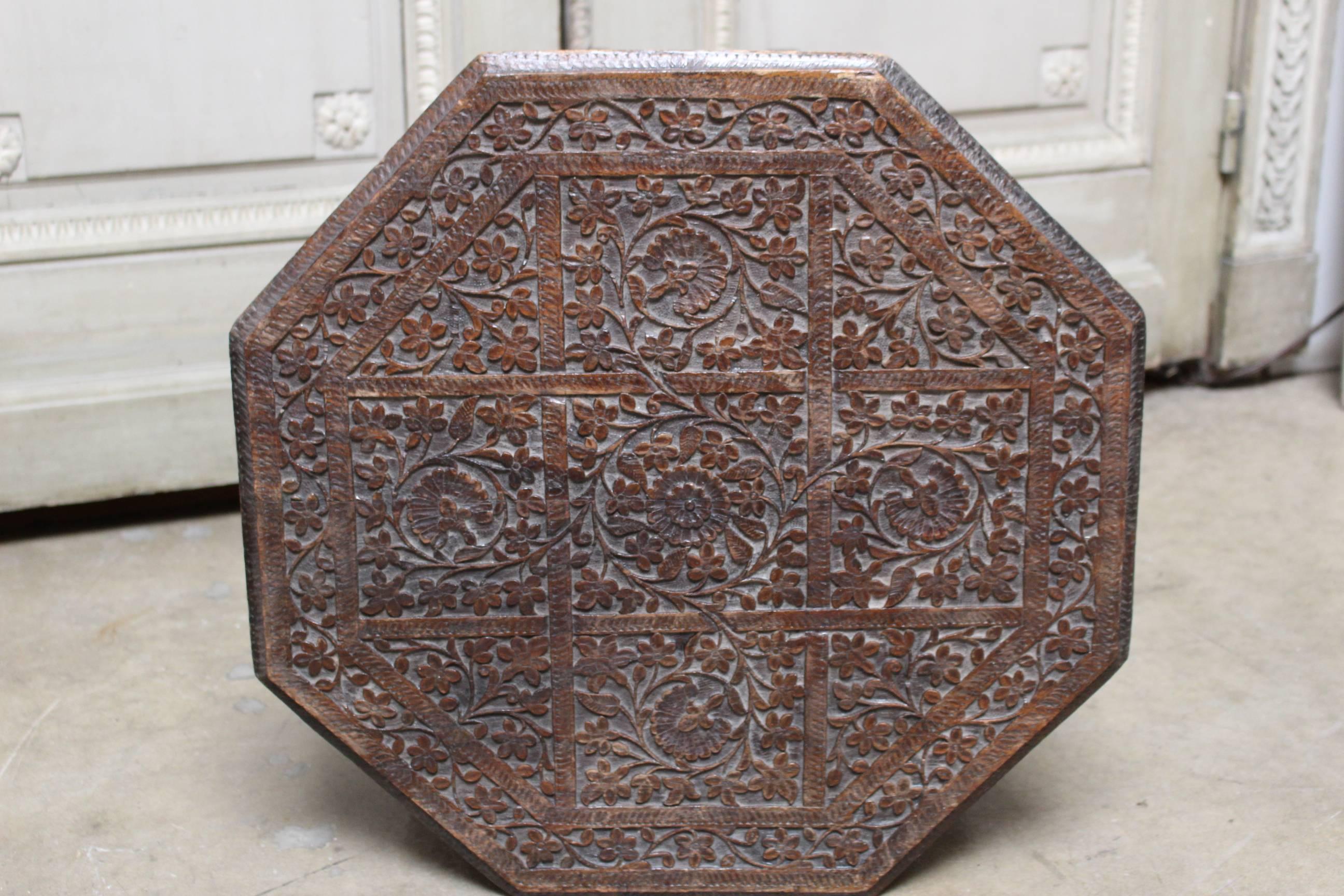 A Syrian carved wood table.