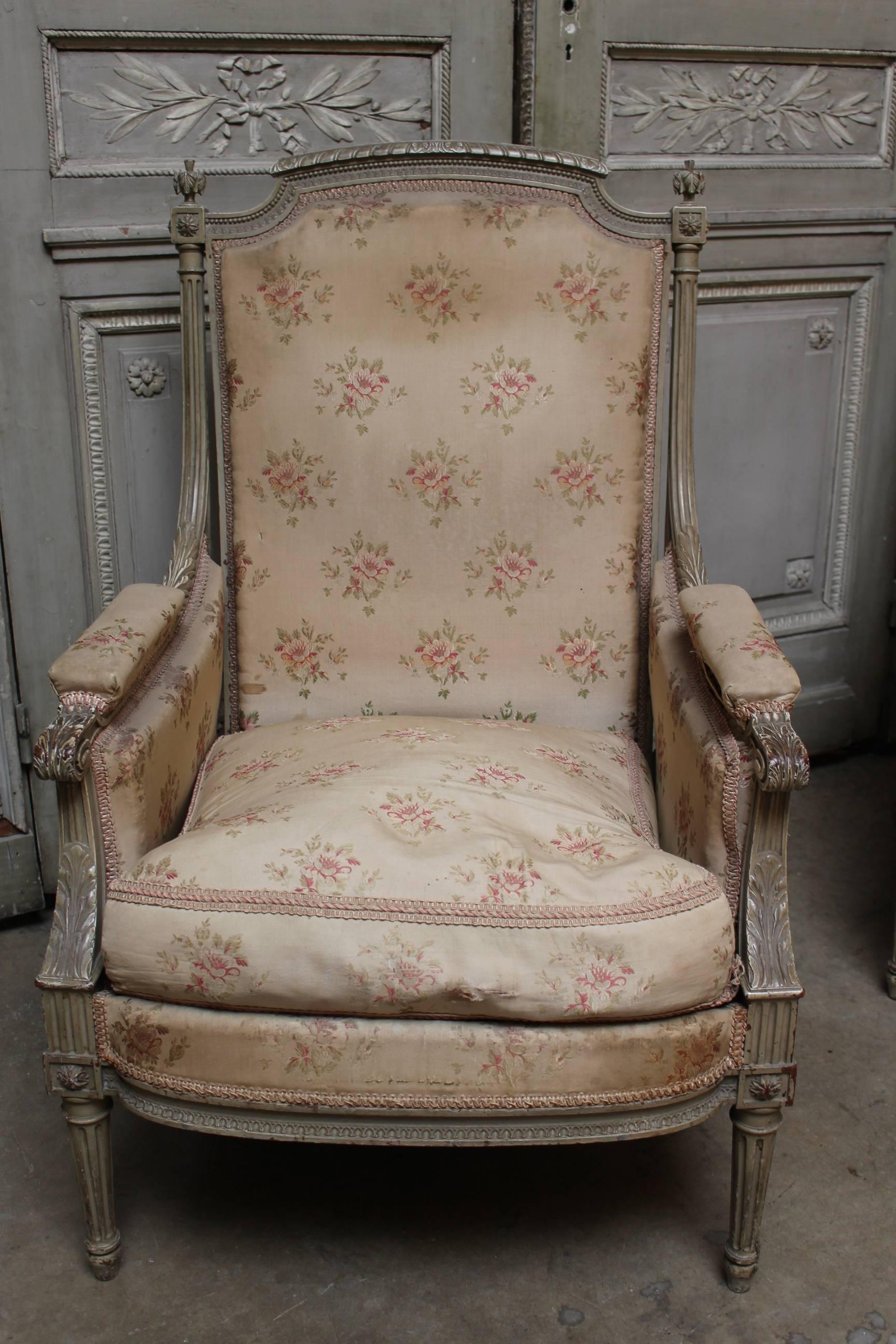 A pair of French Louis XVI style bergères with a painted finish. These are being sold has frames only, they are in need of new upholstery.
