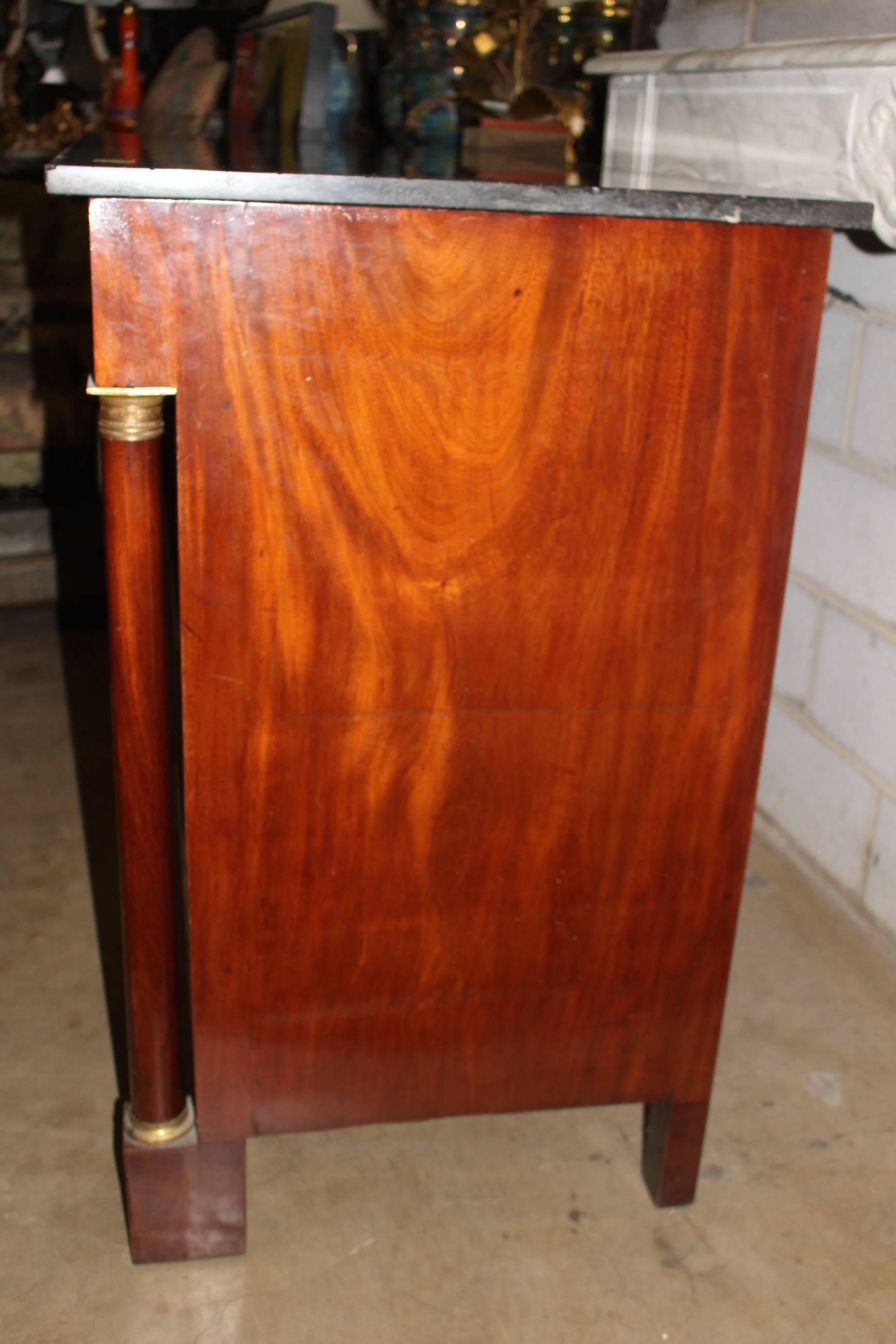 Empire 19th Century French Mahogany Chest of Drawers with a Dark Gray Stone Top For Sale