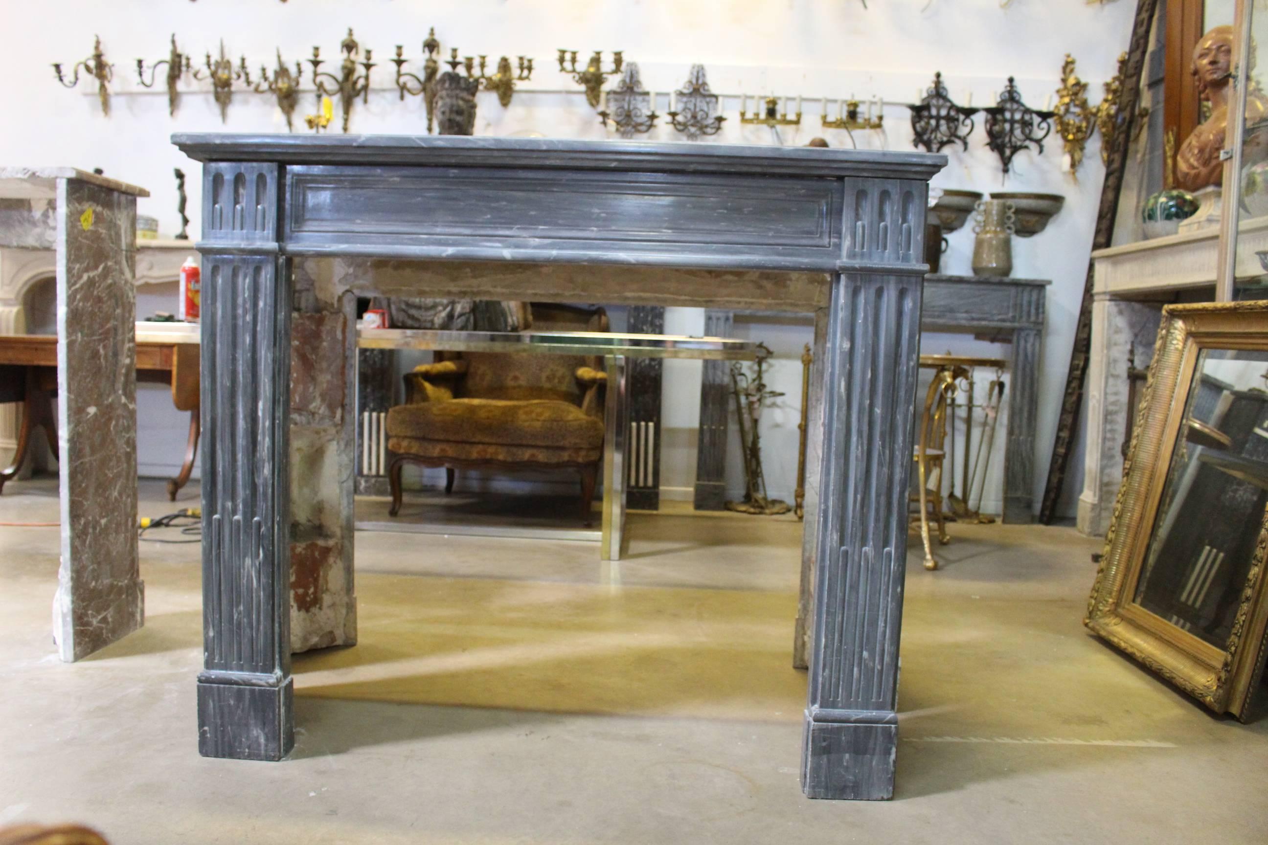 A French Louis XVI mantelpiece in blue turquin marble.