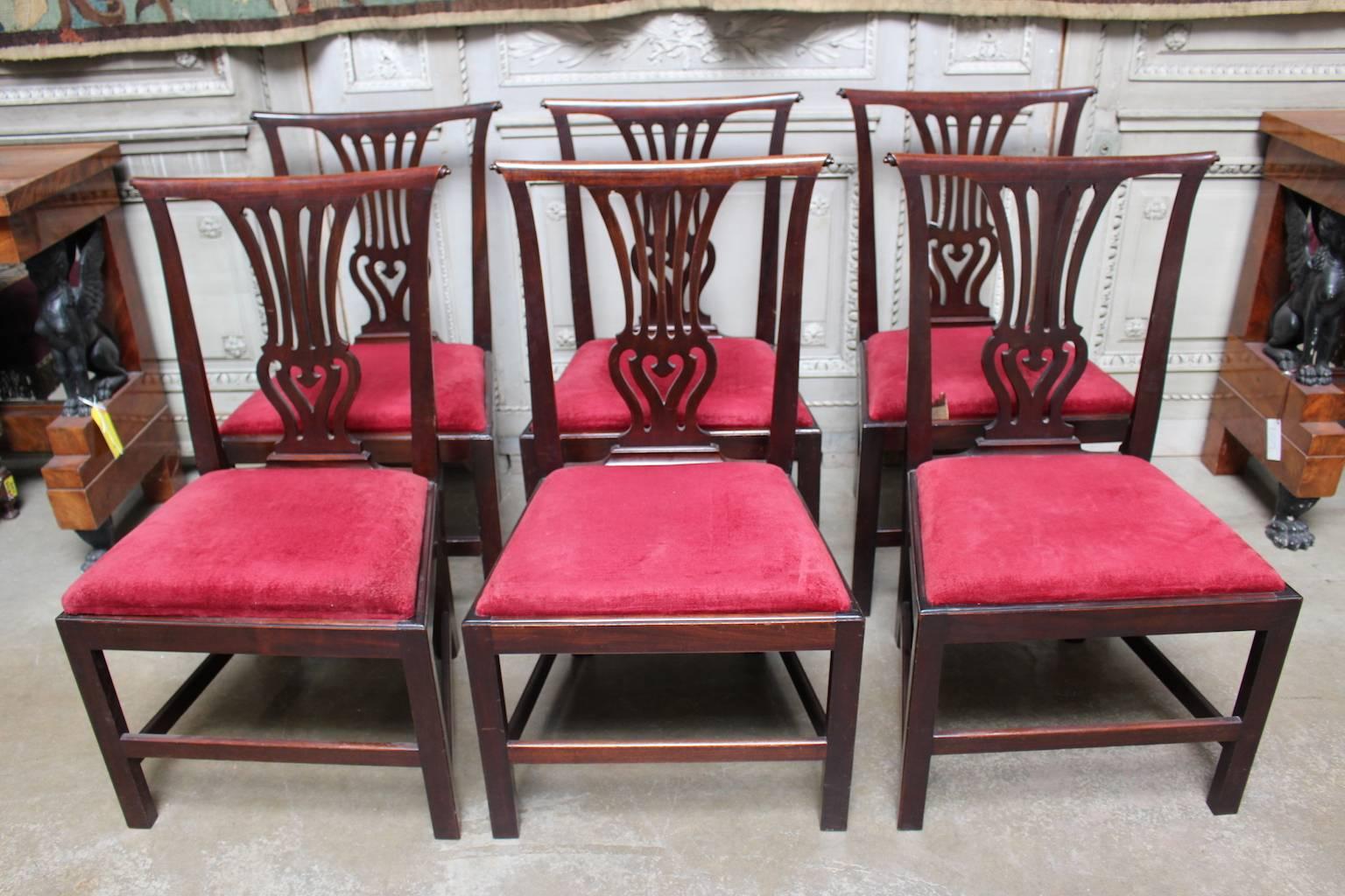 A set of six English George III mahogany dining chairs.