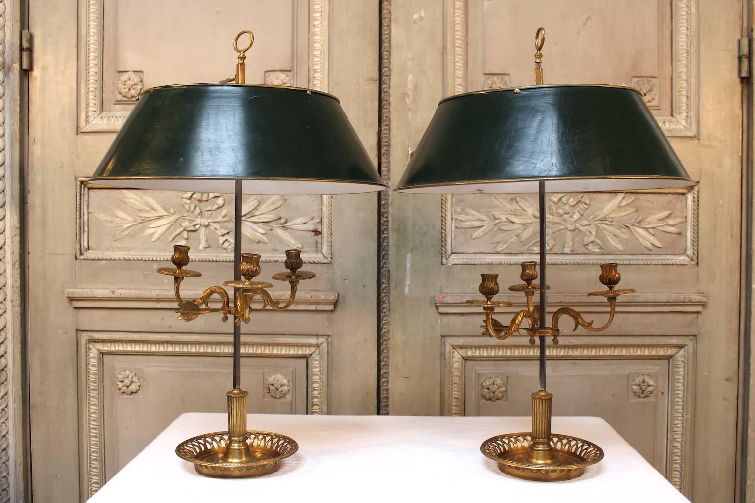 A pair of bronze and tole French Louis XVI style bouillotte lamps, not yet wired.