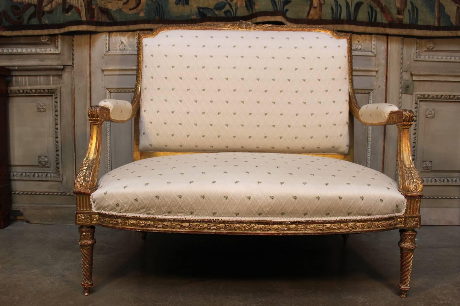 A French Louis XVI style giltwood canape settee.