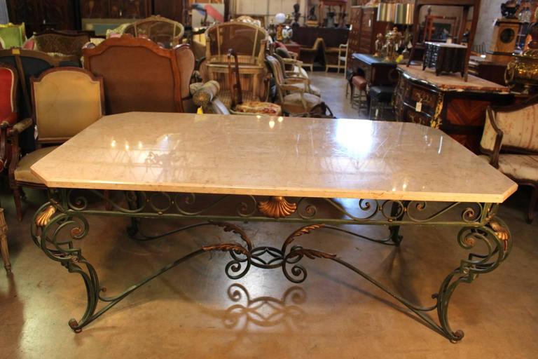 A French Louis XV style painted iron and marble dining table.