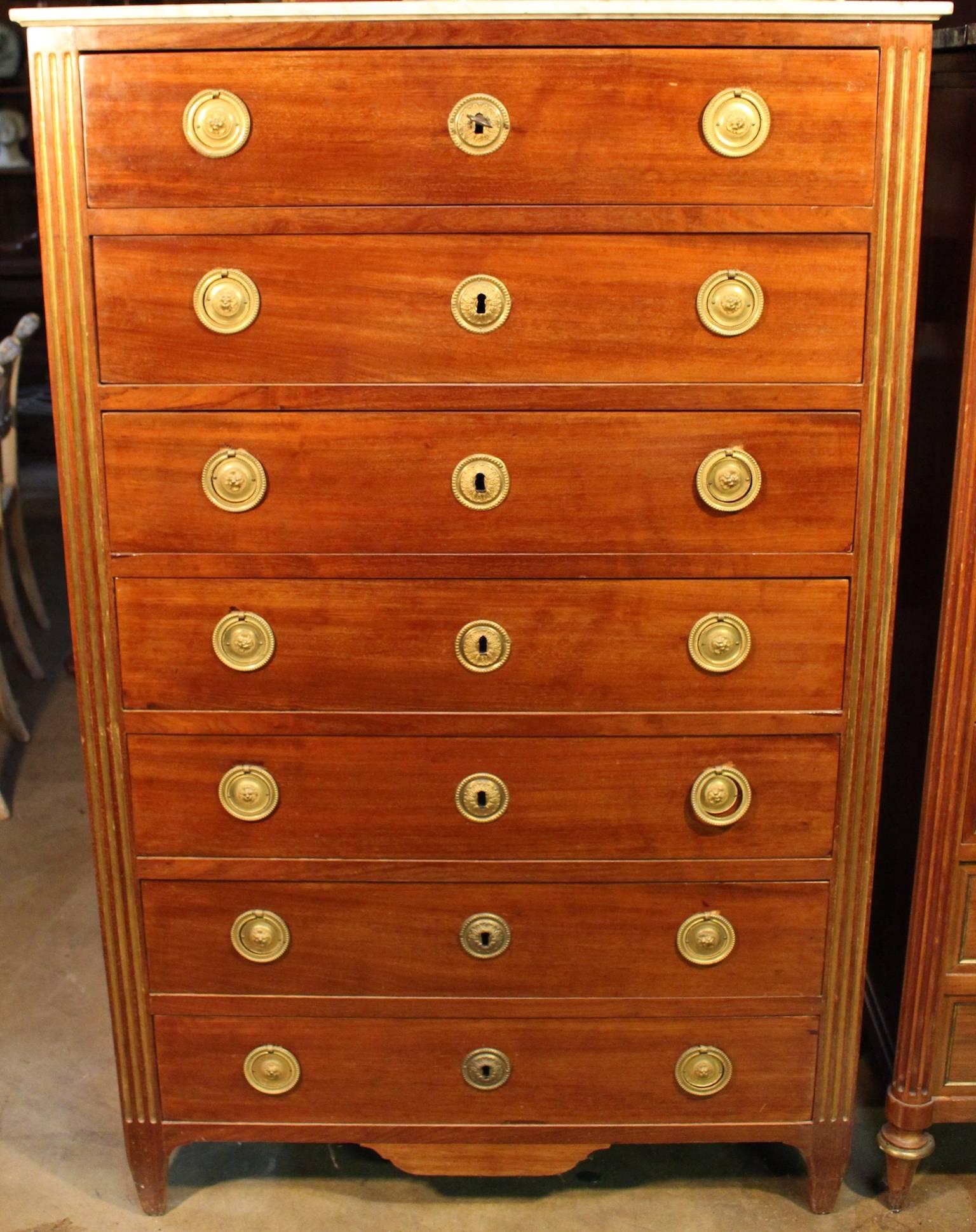 A Swiss Louis XVI style mahogany semainier with marble top and bronze hardware.