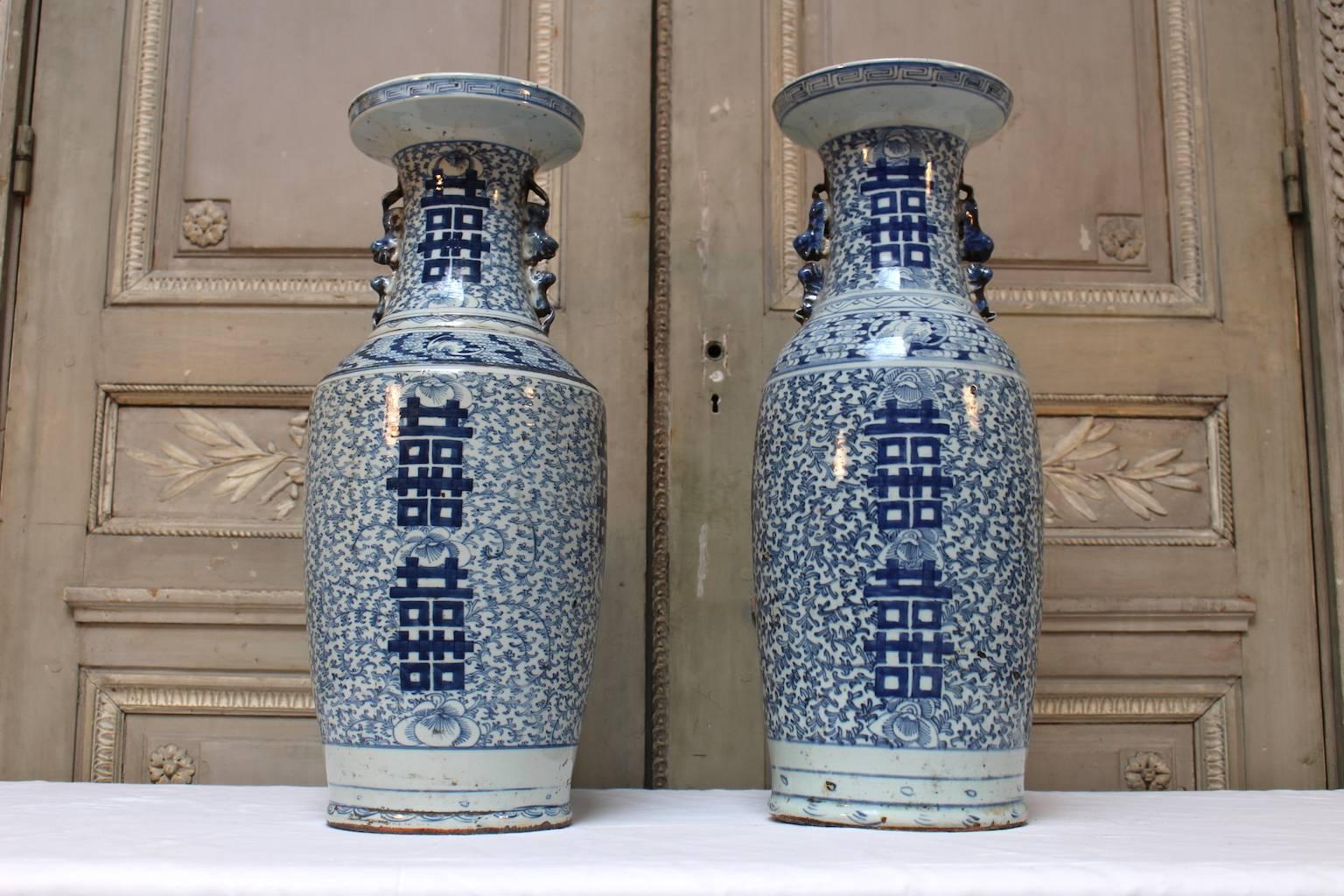 A matched pair of Chinese porcelain blue and white double happiness vases,
late 19th century.
