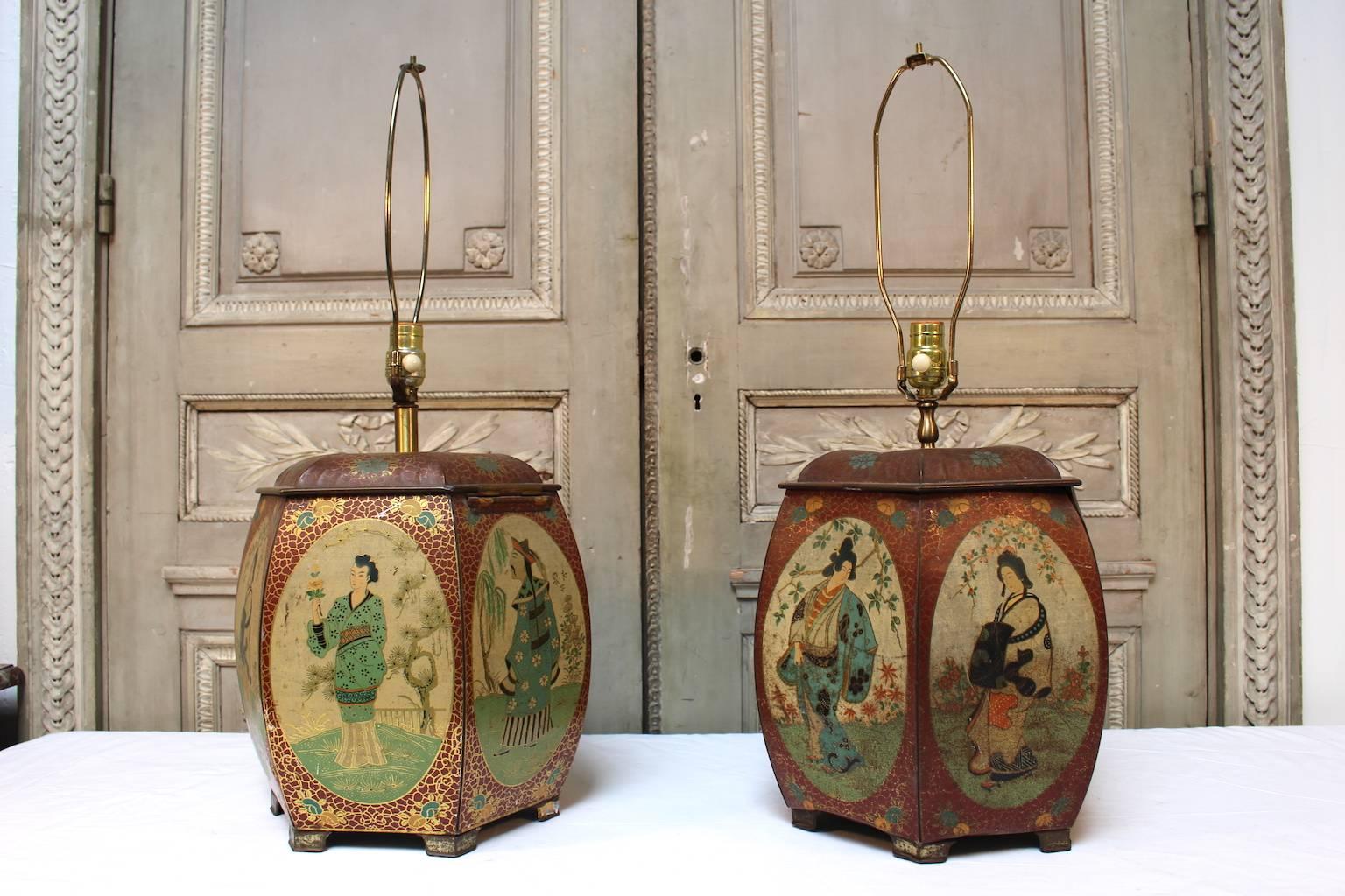 A pair of Chinese painted tin tea containers, mounted as lamps.