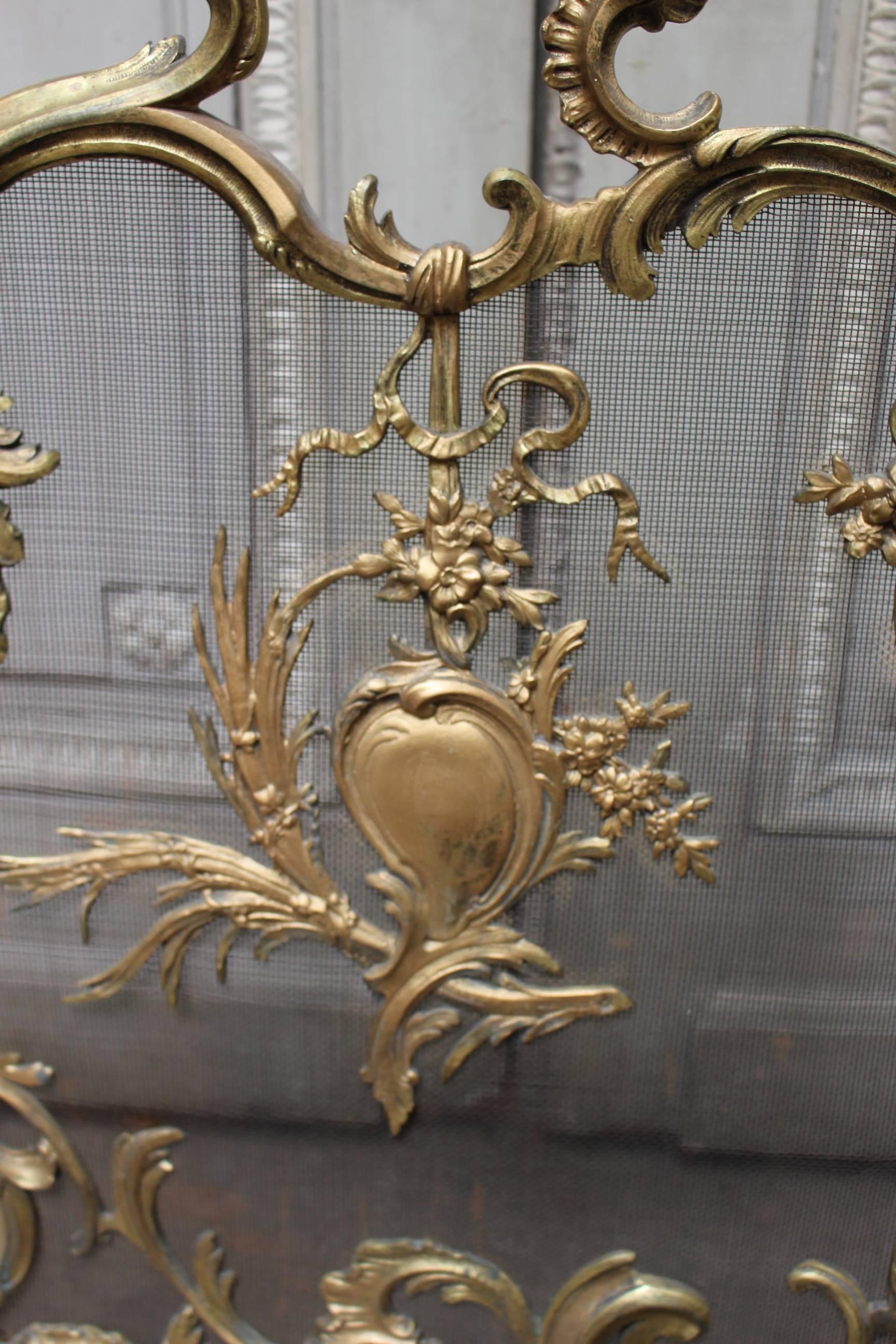 A 19th century French Louis XV style bronze fire screen.