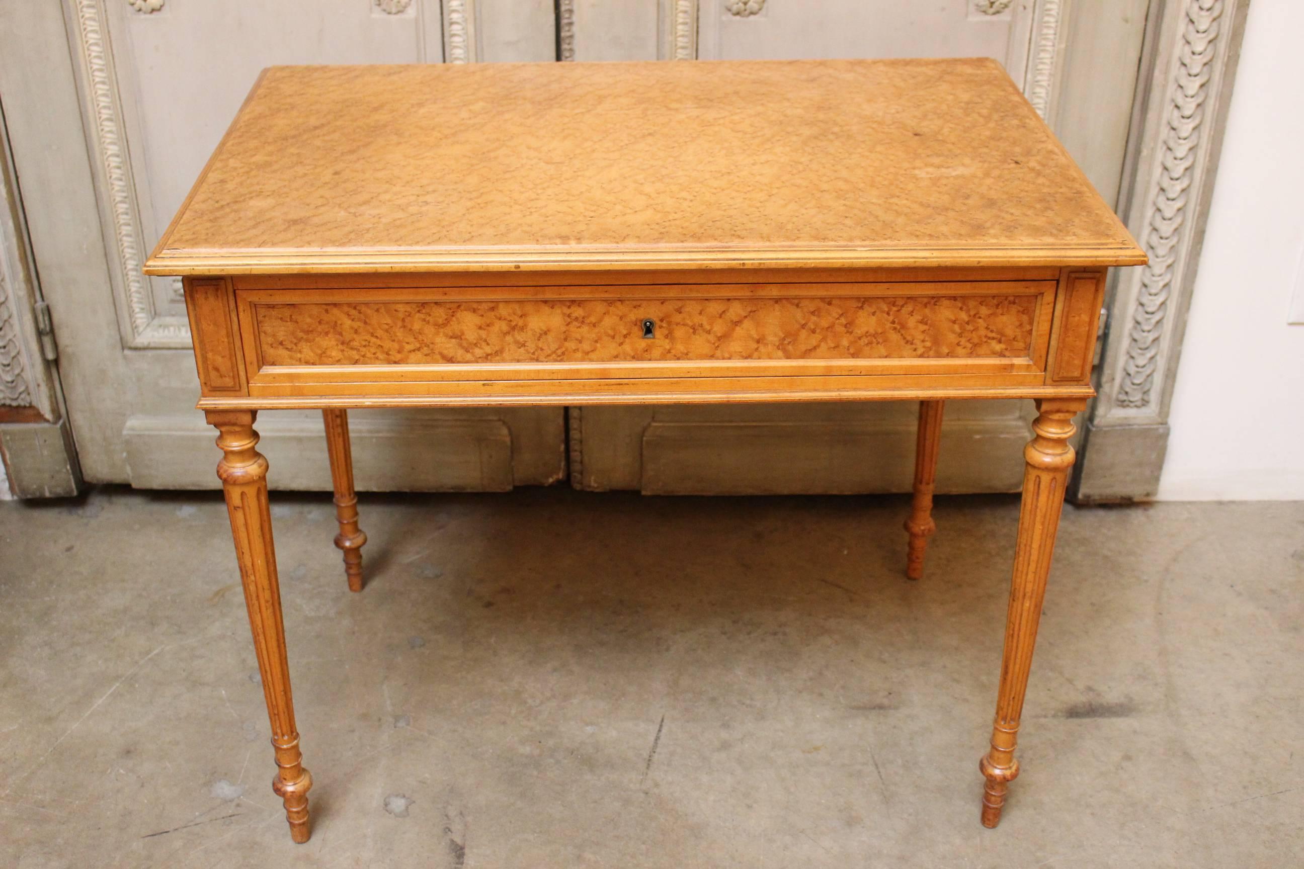 A French, Louis XVI style maple writing-side table.
