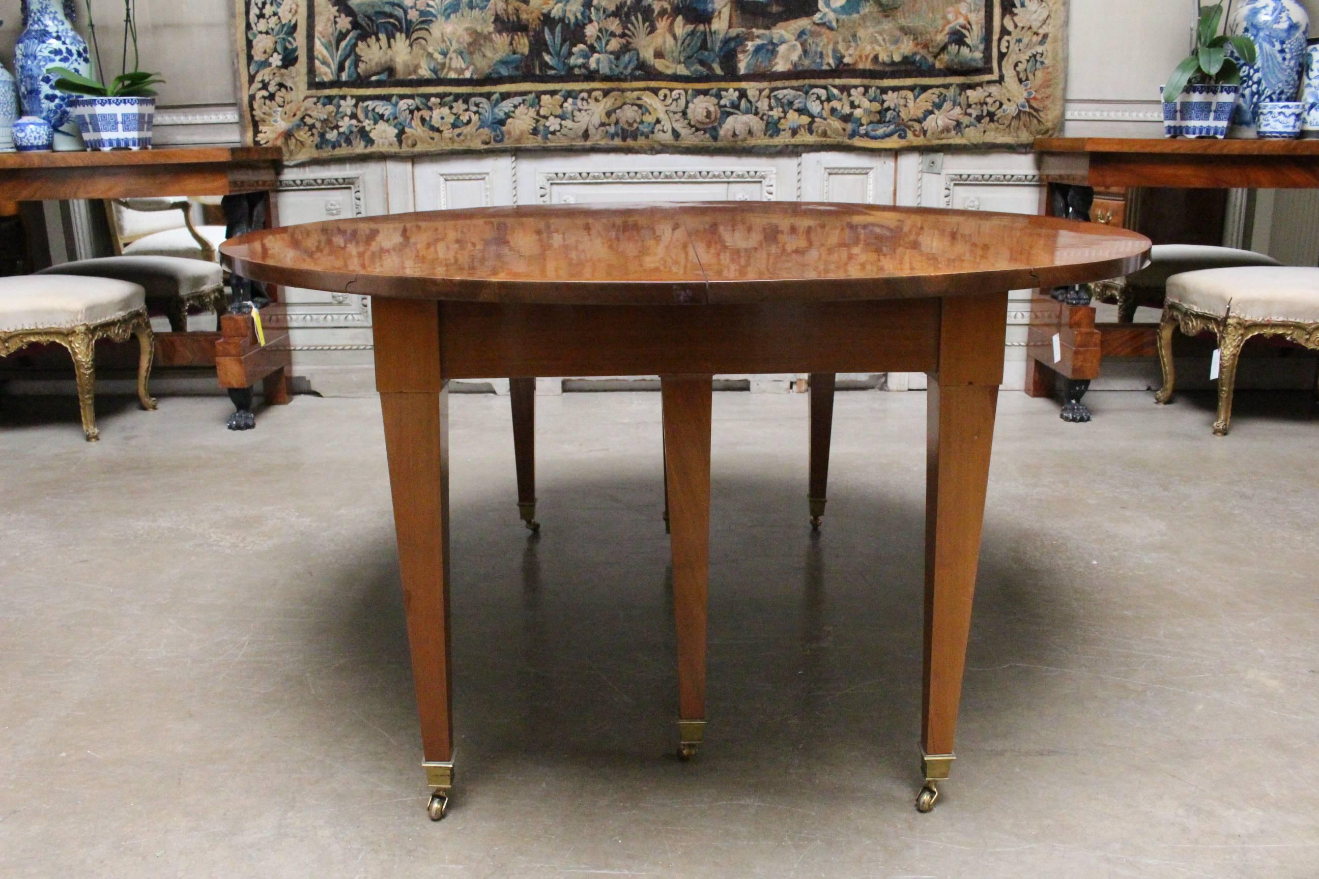 A French XVI mahogany extension dining table with three mahogany veneered leaves from a later date.