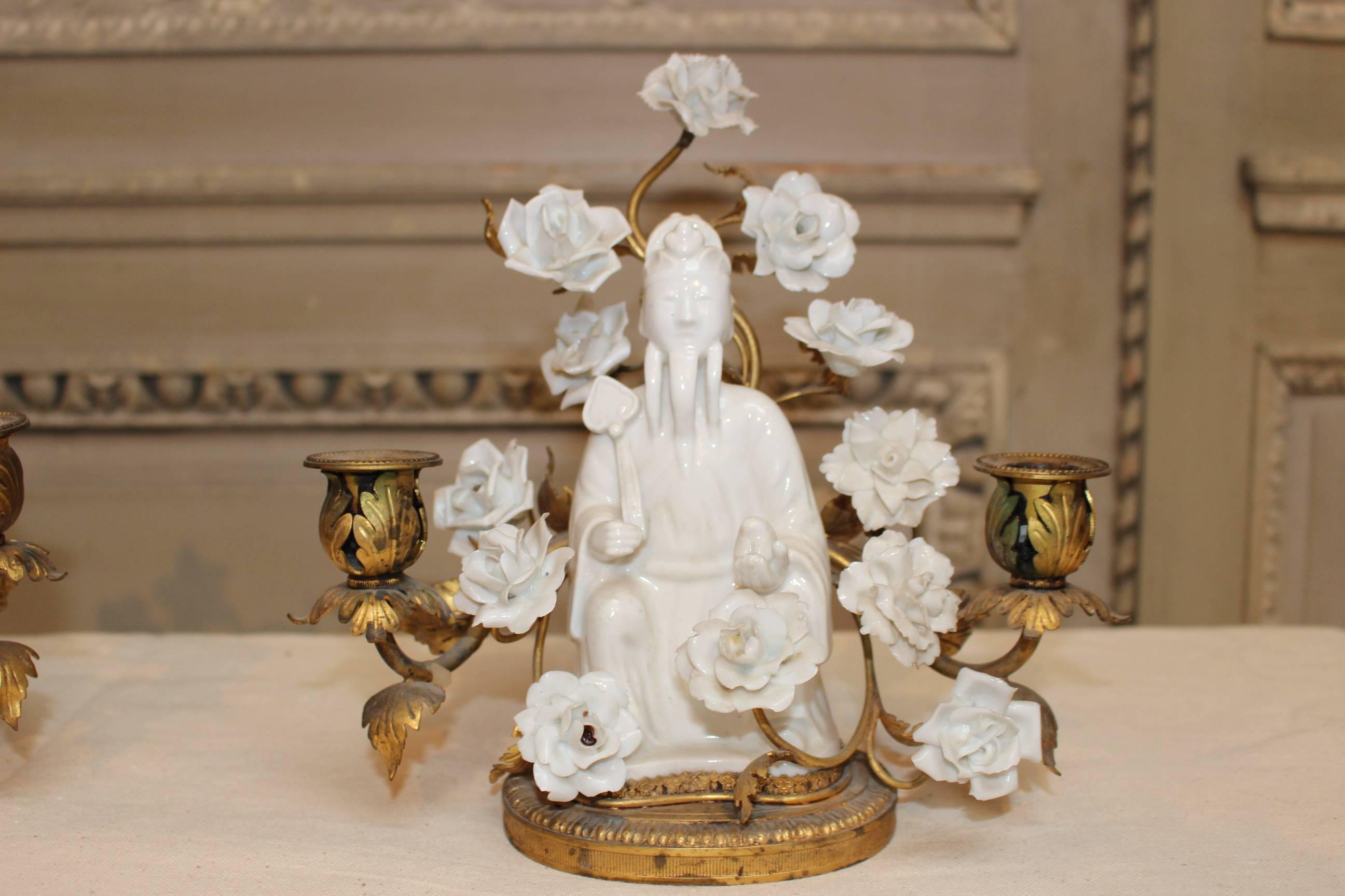A pair of Chinese porcelain figures with French porcelain flowers and bronze mounts.