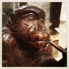 A Japanese Bronze Monkey Smoking A Pipe