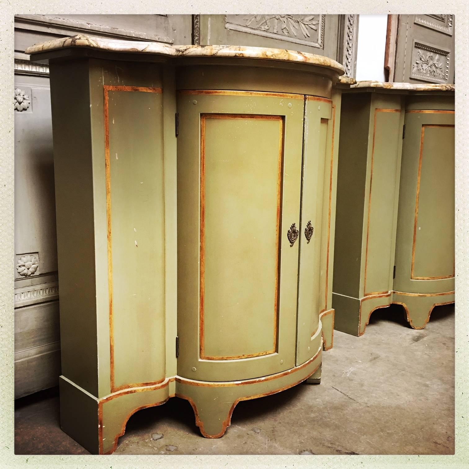 Palladian A Pair of Painted And Parcel Gilt Cabinets With Marble Tops