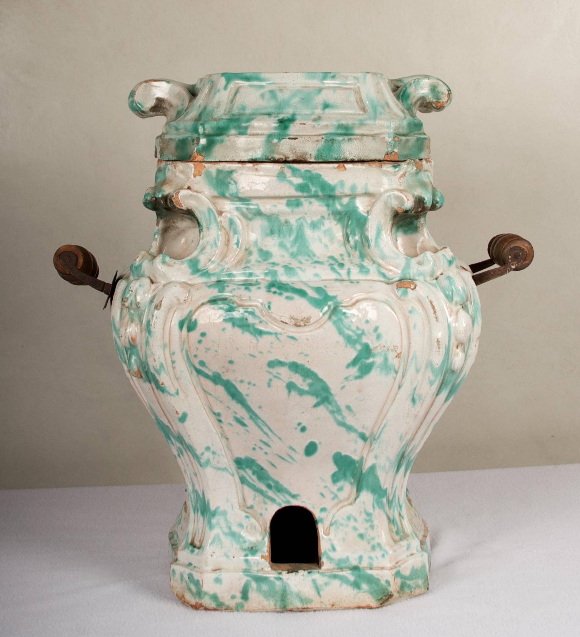 Very rare Rococo chamber warmer, of French or Austrian origin.
There are simply not many of these coal pot's remaining, due to the fact
that they were very utilitarian, and being glazed terra cotta, they are 
somewhat fragile and even though in