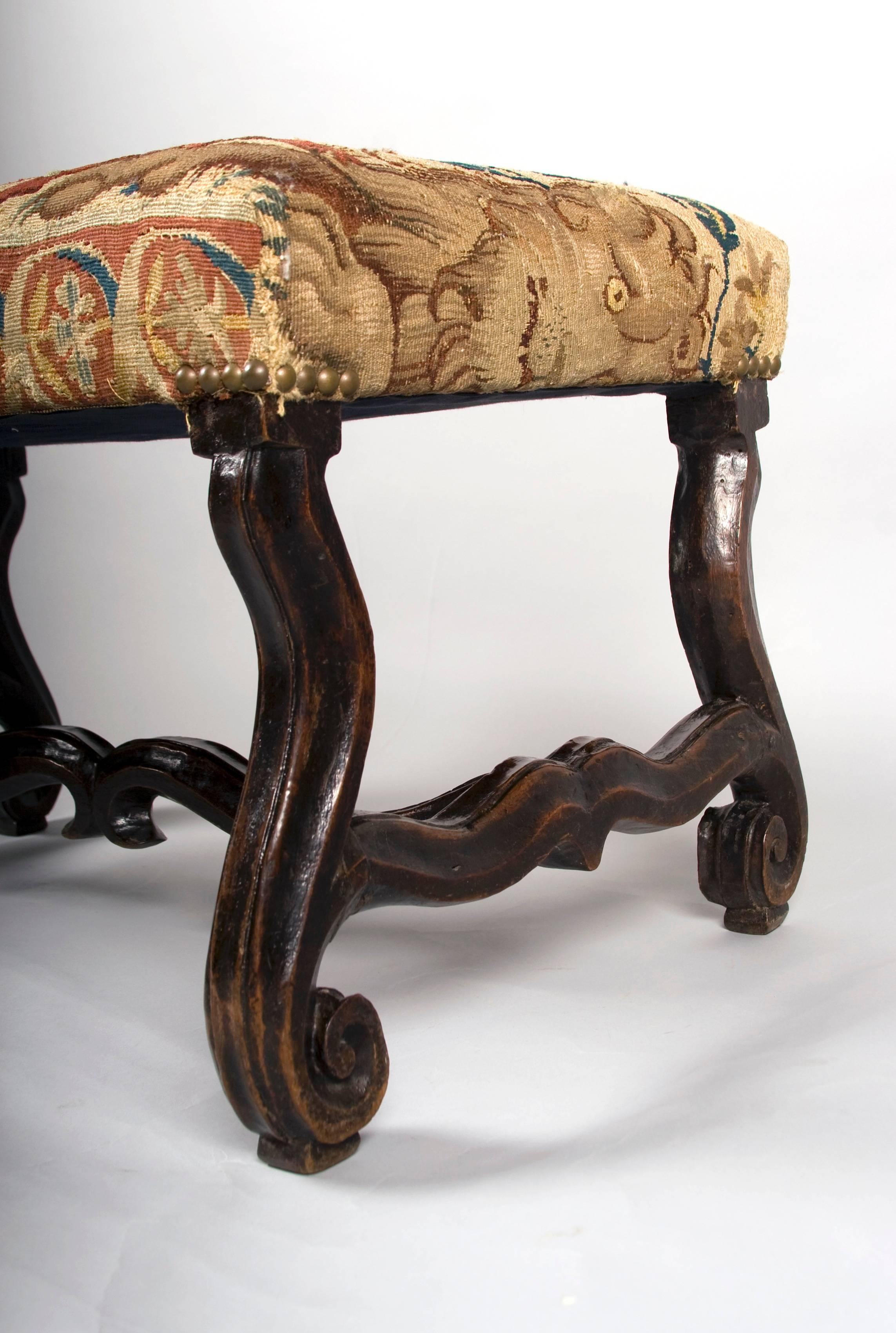 18th century stools, in walnut, upholstered with 16th century Tapestry
fragments, one stool with a wonderful child petting his dog and the
second one sporting a eagle. Both tapestries are in wonderful detail
repaired condition. The stools are