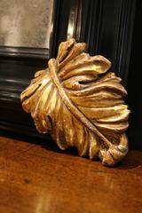 Italian baroque style  Mirror with hand-carved gilt details, aged mirror glass