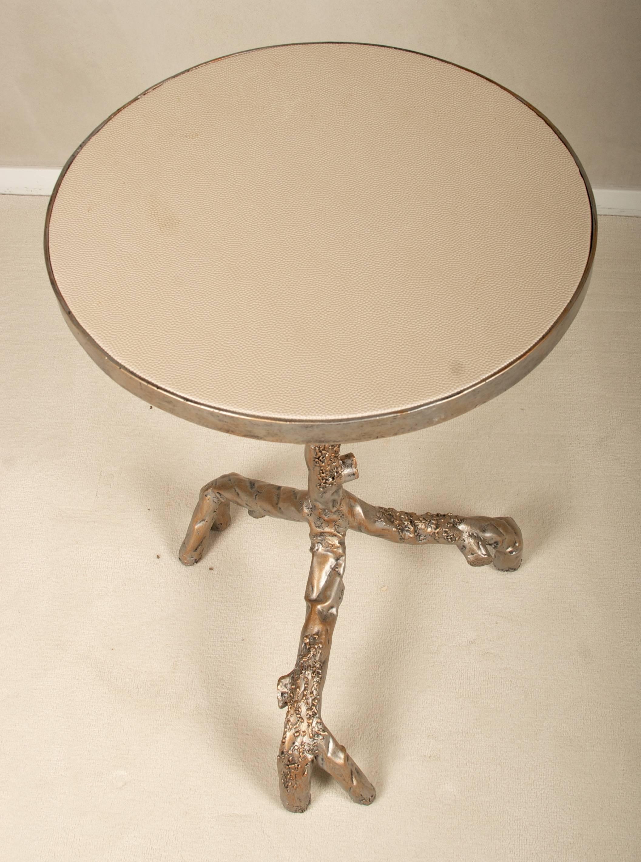 A lovely tree branch design side table with faux leather inset top.
               