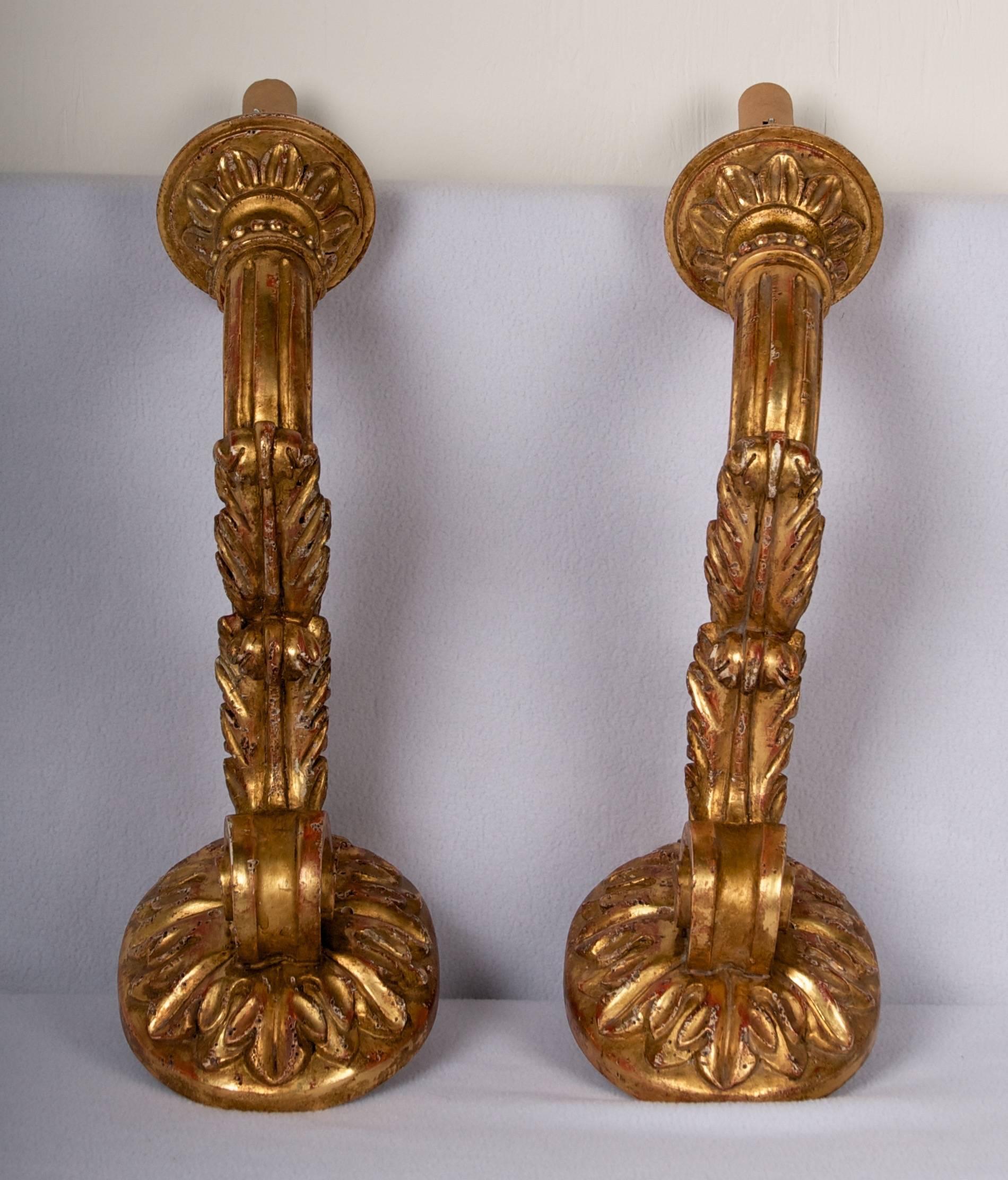 Grand pair of sconces, lovely detail carving, ready for direct wire mount.
These sconces are in perfect condition.