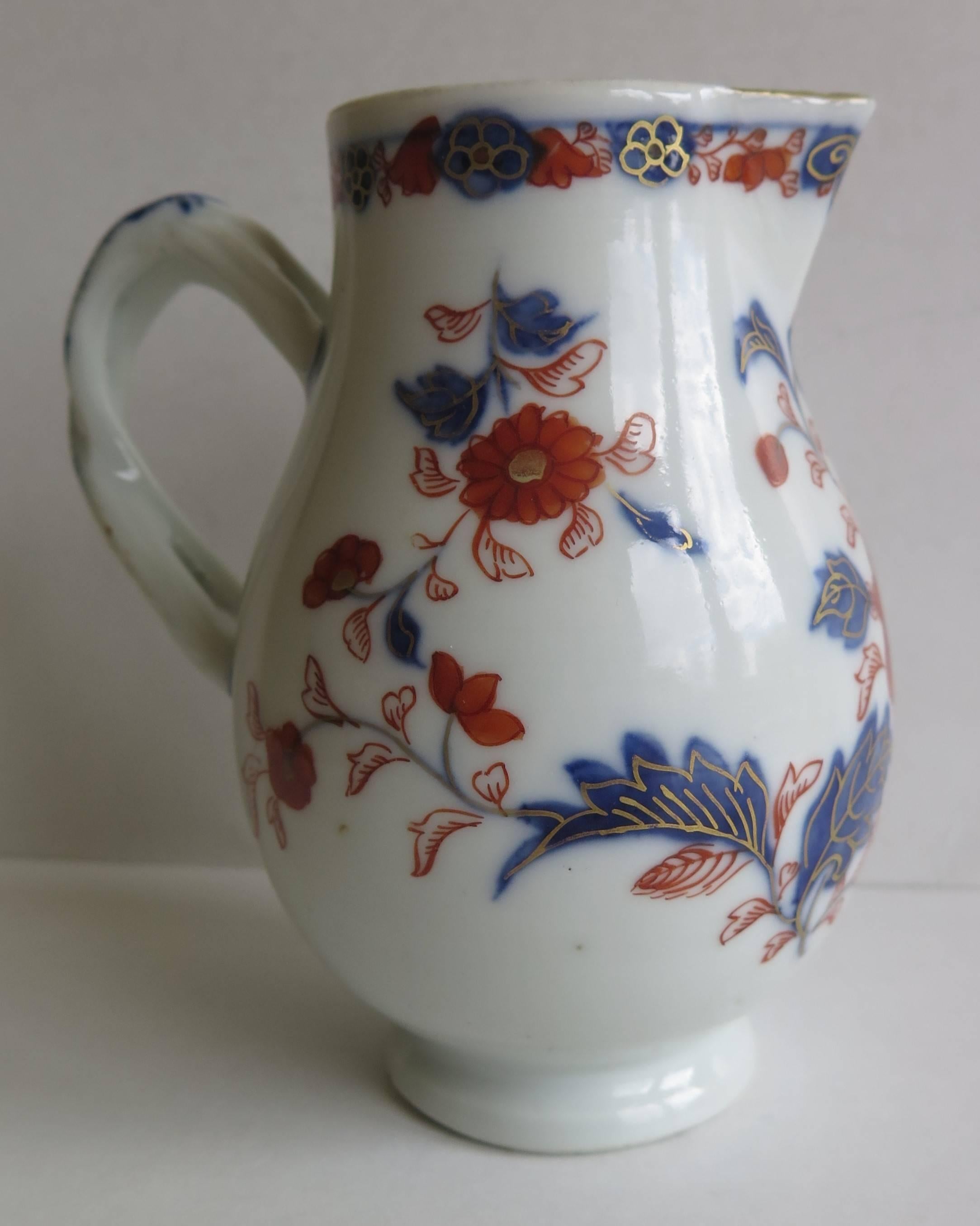 This is a Chinese porcelain, hand painted, Sparrow-beak milk or cream jug / pitcher from the early-mid-18th century, Qing dynasty, circa 1730.

The jug is pear shaped with a Sparrow beak spout and very nice entwined simulated rope handle.

The
