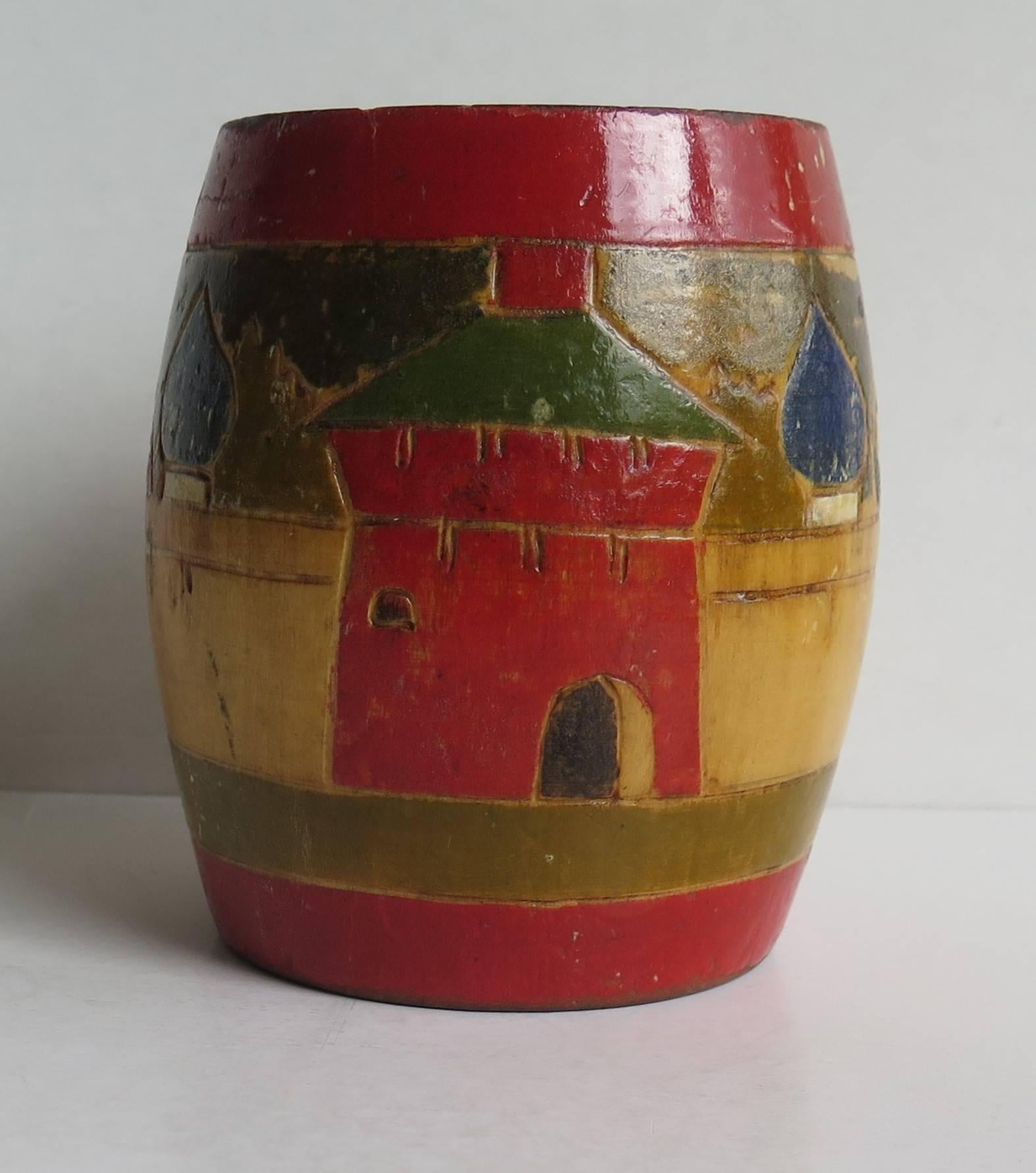 This is a good hand made and painted Folk Art small spill vase or container of central European origin, dating to the mid 19th Century.

The vase is made of wood, hand-turned in the shape of a barrel with hand-carved detail to the outside, depicting