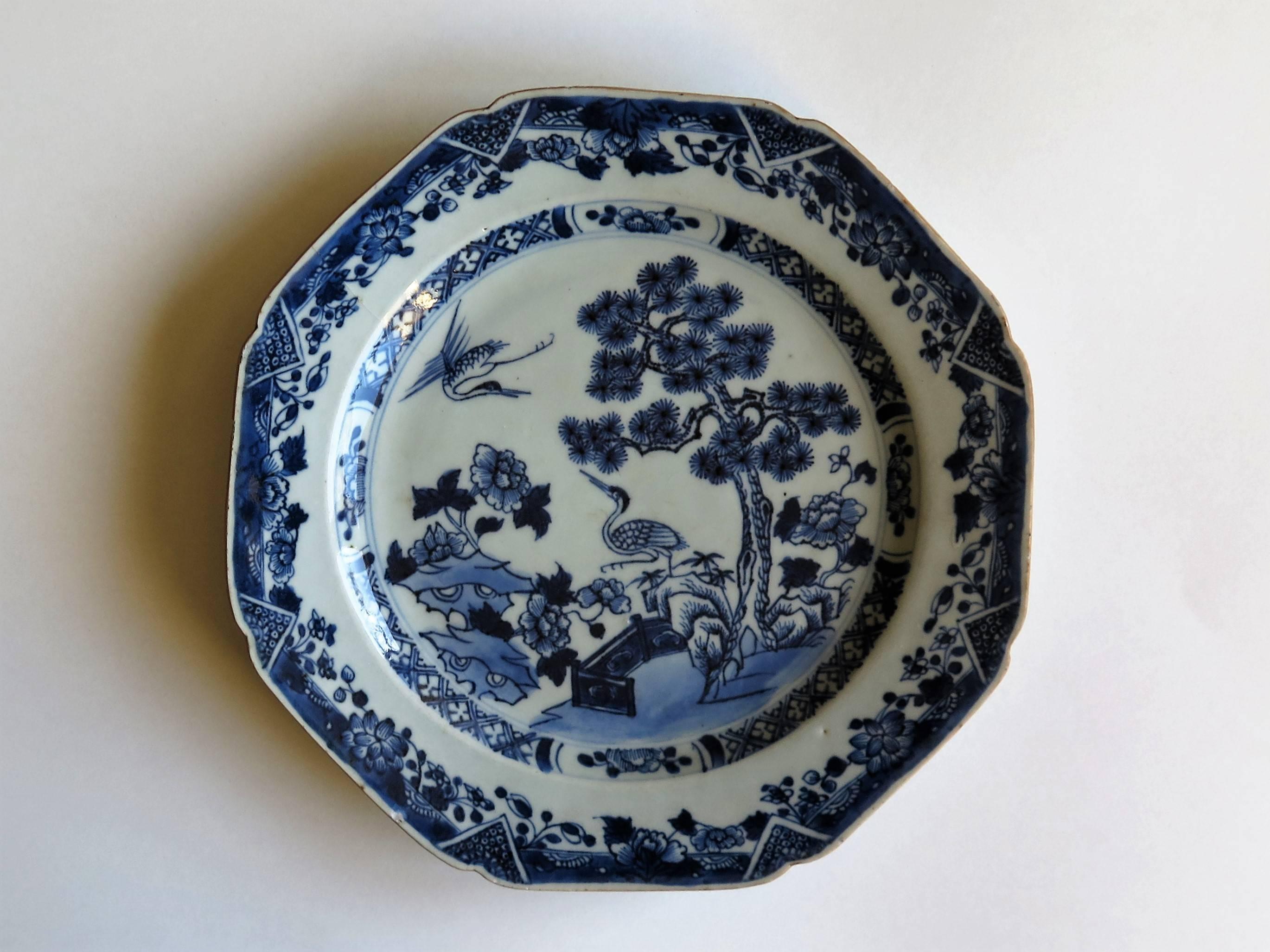 This is a Chinese porcelain plate made for the export (Canton) market, during the Qing dynasty in the second half of the 18th century, circa 1770.

The plate is octagonal and is very well hand decorated in varying shades of cobalt blue in a free