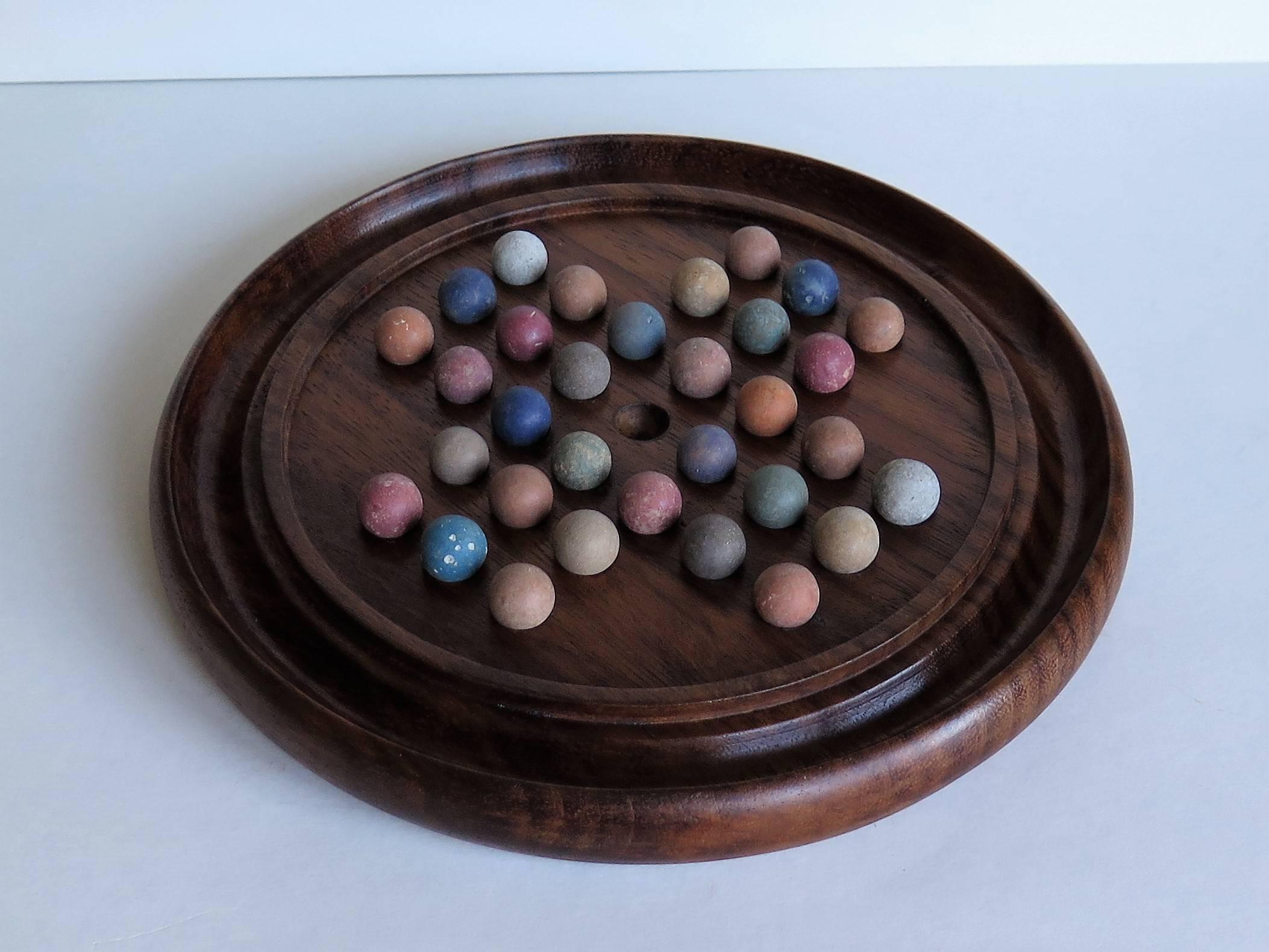 English Edwardian Marble Solitaire Board Game, Mahogany board with Older Clay Marbles
