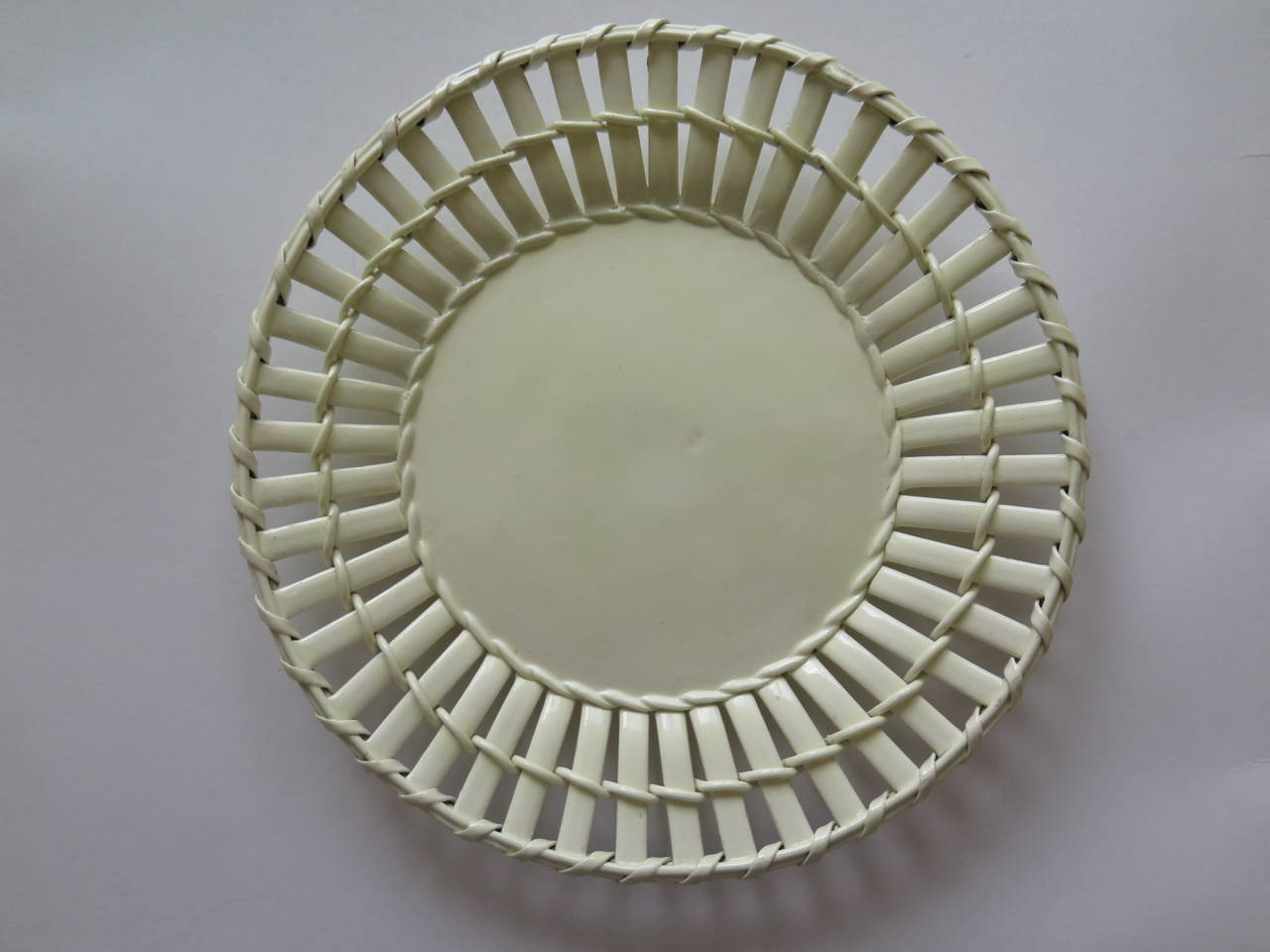 This is an excellent latticed creamware dish or plate by Leeds Pottery of Jack Lane, Hunslet, Leeds in Yorkshire, England, made in the late 18th Century, circa 1790.

The plate is made of a type of earthenware called Cream-ware

This plate has a