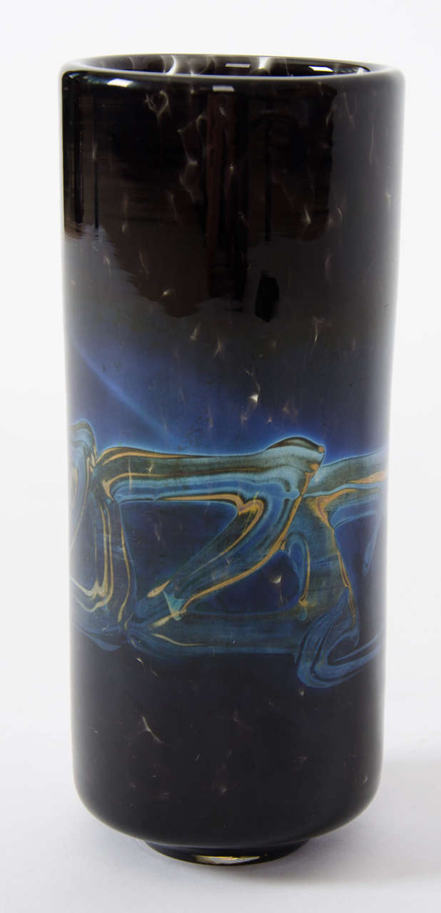 This is a very good mid-20th century Murano Italian art glass cylinder vase that we attribute to Venini and Co. made circa 1940.

The vase is cylindrical in shape on a low foot. It is beautifully made with an oily iridescent trailed decorative