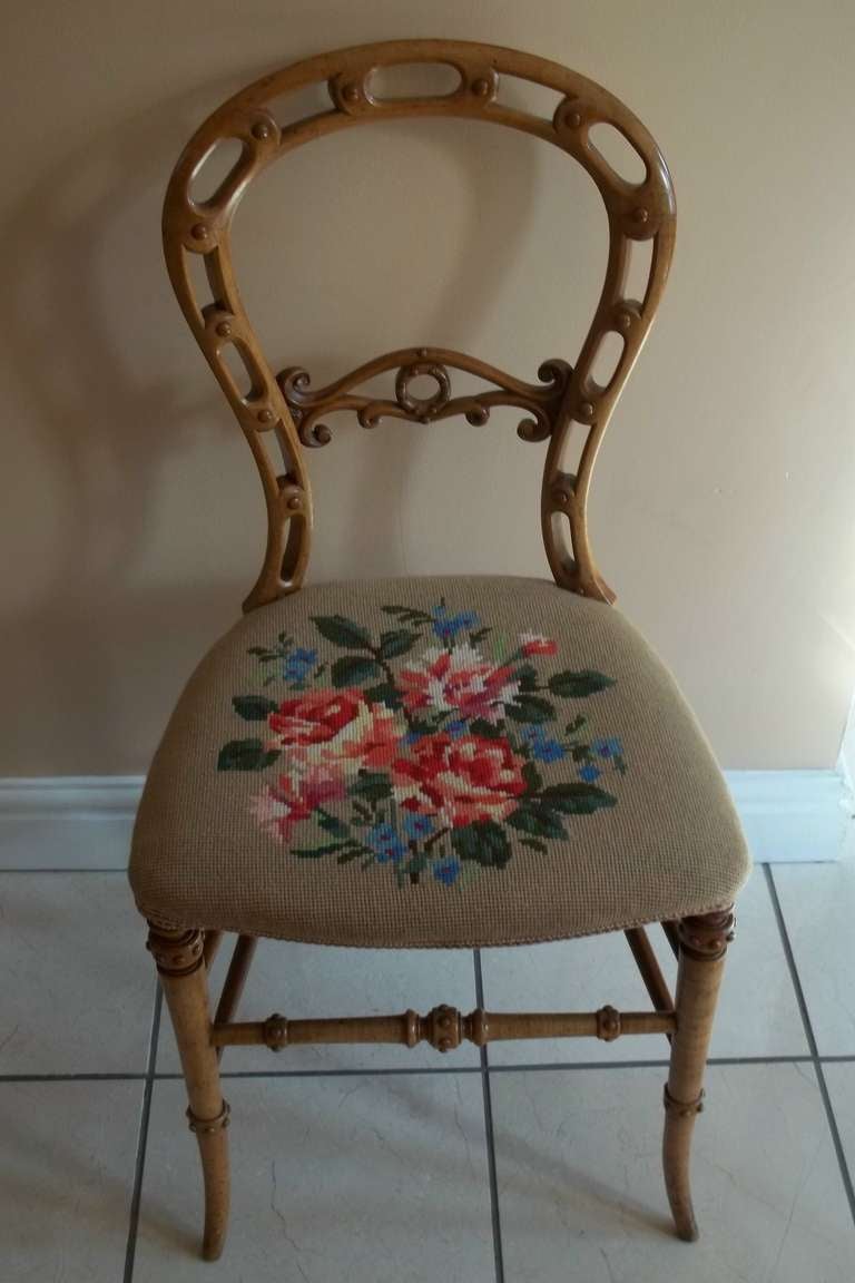This is a very good quality example of an English occasional side chair in the Rococo style, from the mid Victorian period, circa 1850, made from Beech.

The back is a Classic balloon back shape, but with intricate cut-out and carved detail to the