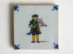 A 19th Century Dutch Delft Ceramic Wall Tile of a Violin Player