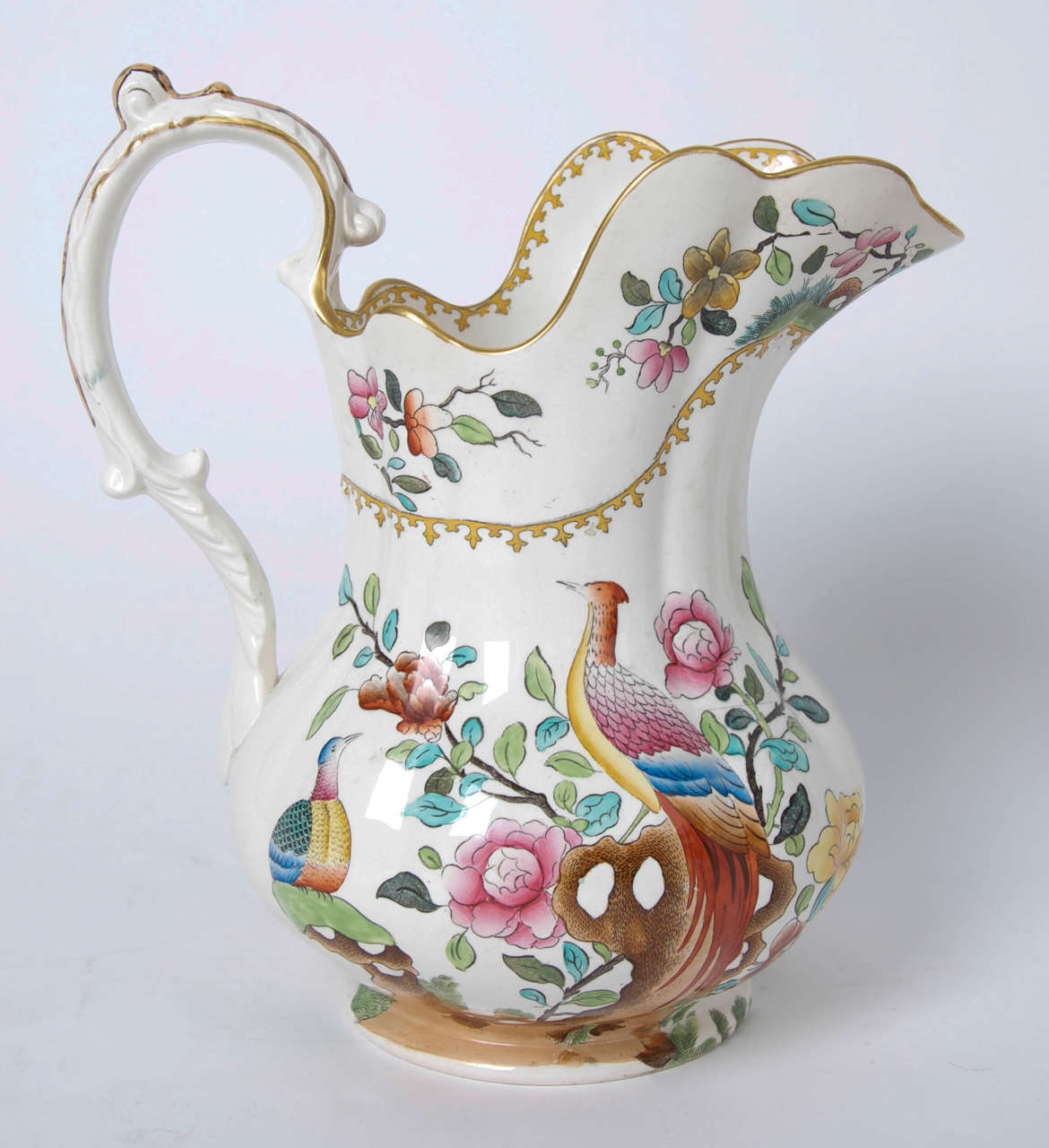 This is a very large and impressive Jug or Pitcher over 12 inches tall, made of earthenware pottery by the Copeland (Late Spode) factory in the late 19th century of Victorian England.

This piece is made of earthenware and is well decorated in the