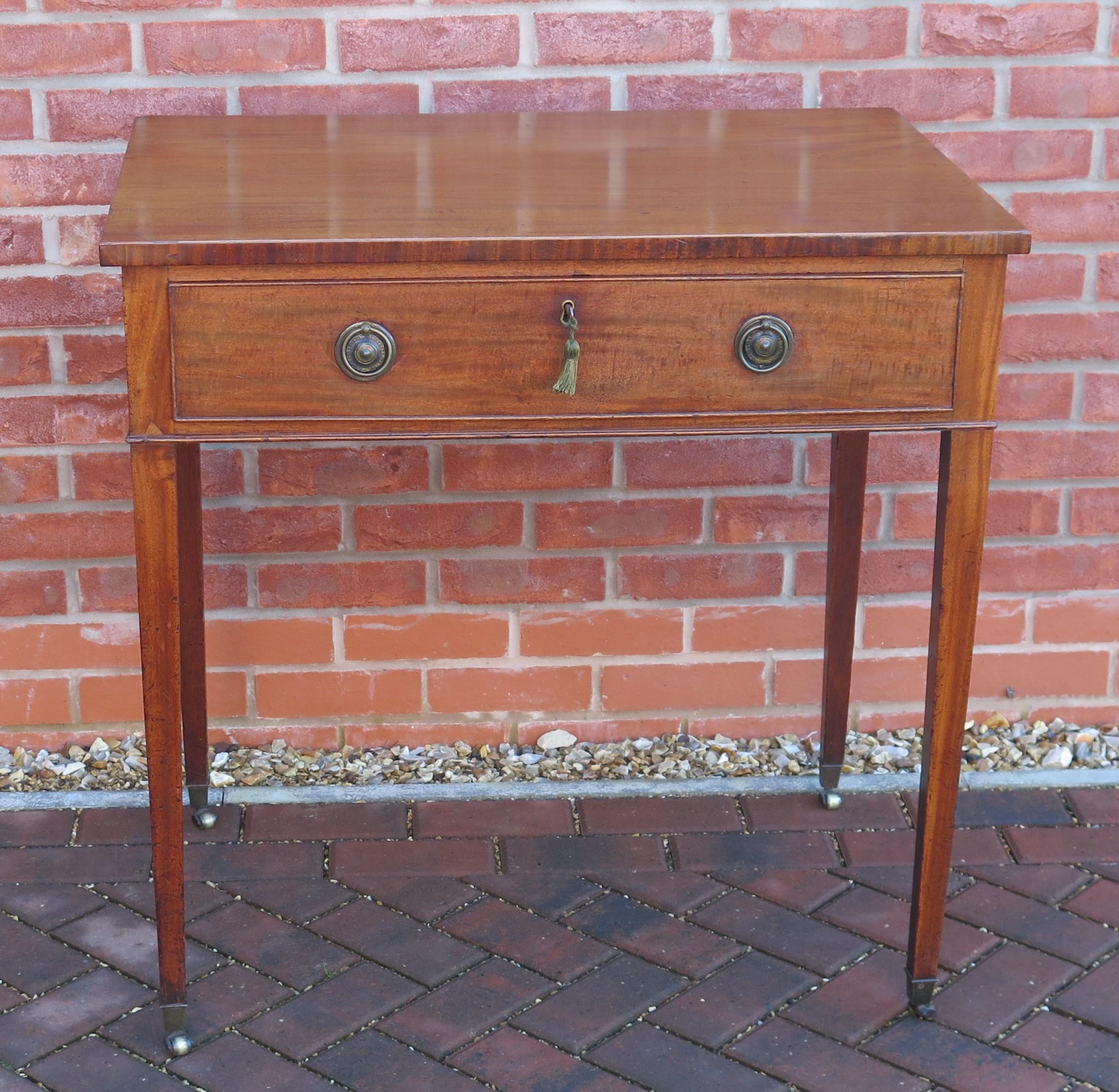 This is a very well made writing or dressing table, dating to the English George III period of the late 18th century, circa 1790.

This is a lovely piece of English furniture with classic proportions consistent with Georgian furniture of this