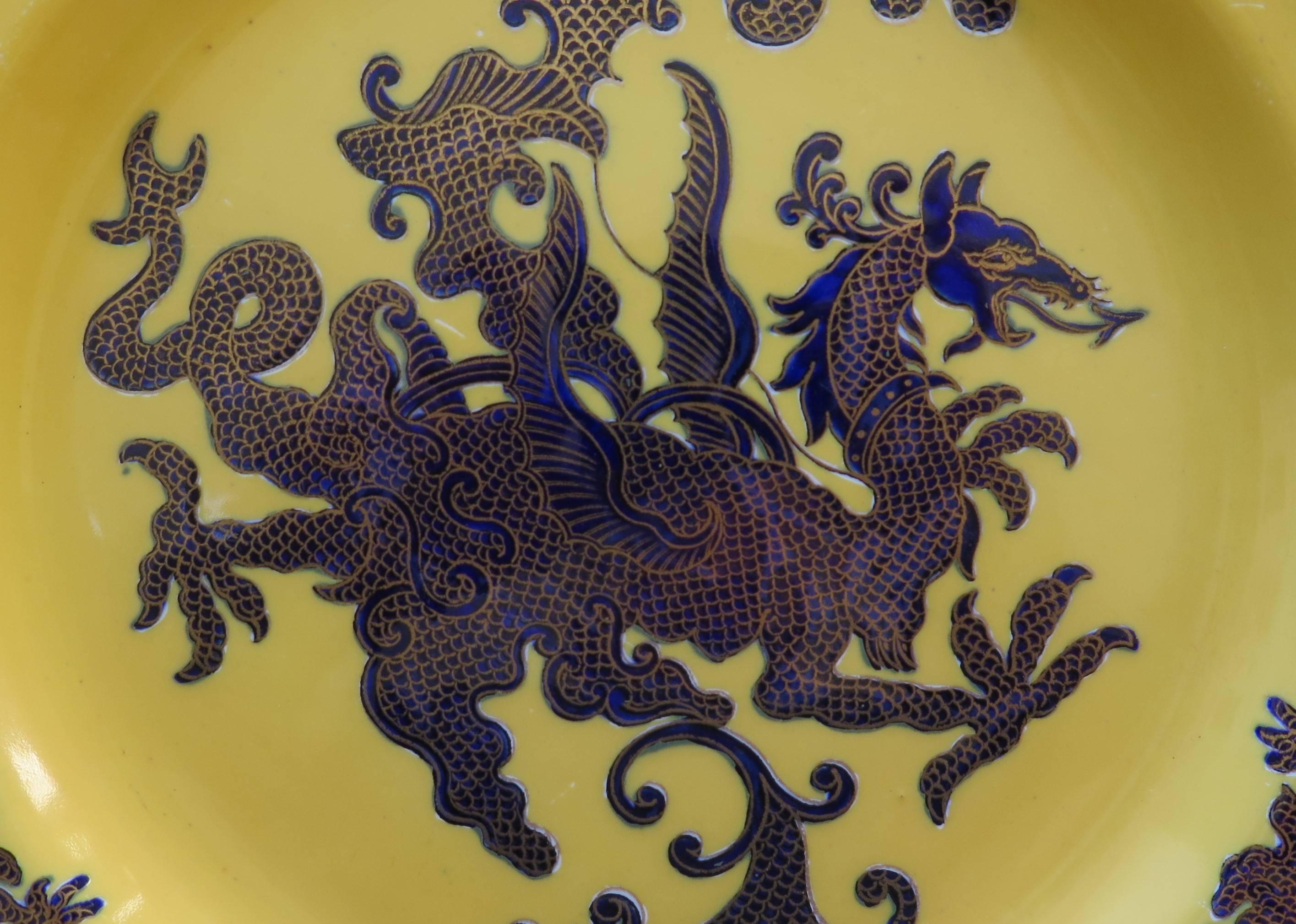 This is a rare and beautiful Cabinet or Wall Plate by Mason's Ironstone, England. 

The Plate is circular in shape with a wavy molded edge.

This plate has one of the rare patterns called Chinese Dragon as documented on page 116 of A Guide to