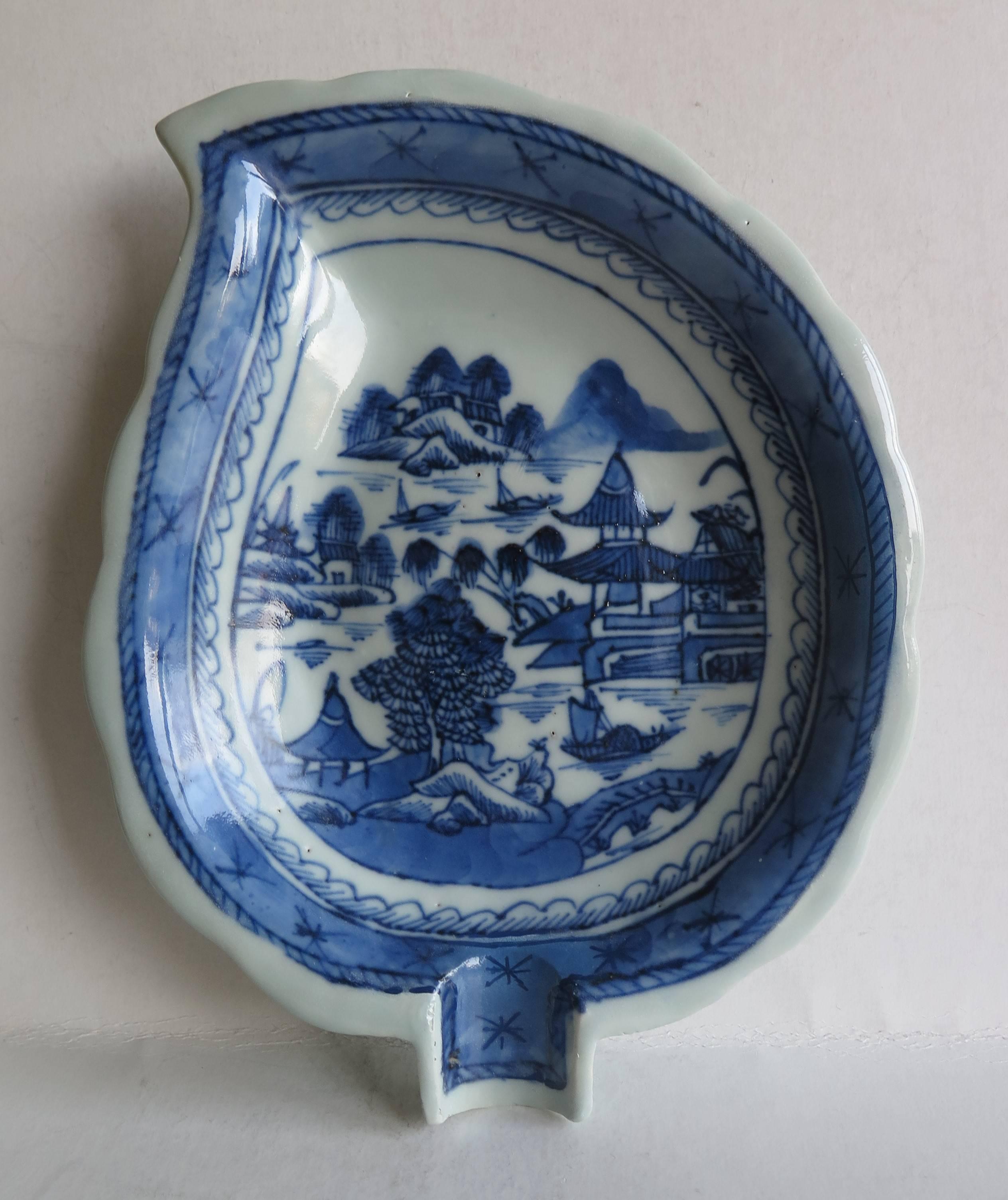 This is a good Chinese porcelain LEAF or pickle DISH made for the Export (Canton)  market.

The dish is leaf shaped with a scalloped edge on a raised foot, decorated in varying shades of blue. The glaze is off white with a very light blue shade