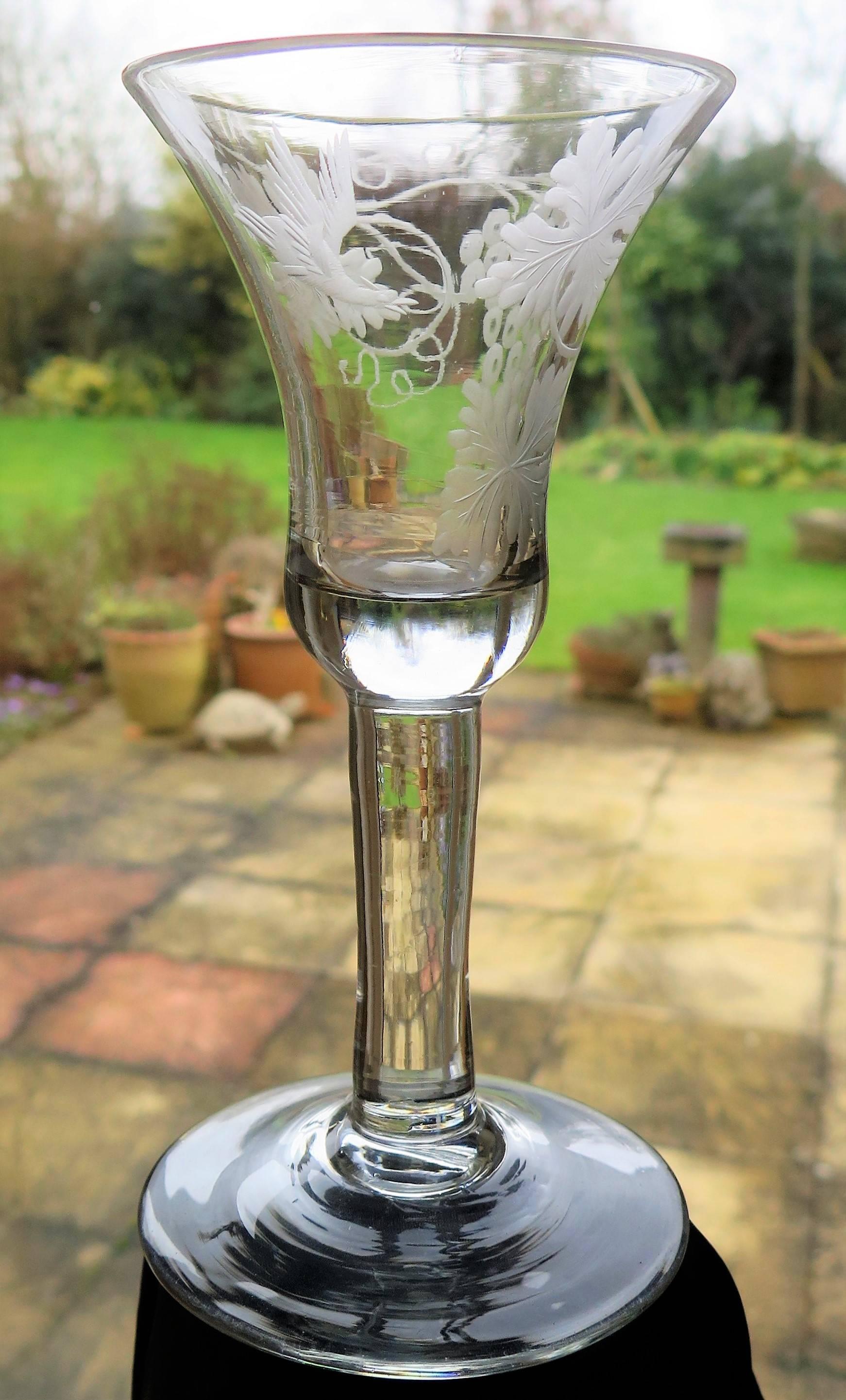 This is a very good English, Georgian, Hand-blown, Engraved Wine drinking glass, dating to the George II Period of the mid-18th century, circa 1745.

These glasses are very collectable.

This wine glass is handblown from English lead glass. It is