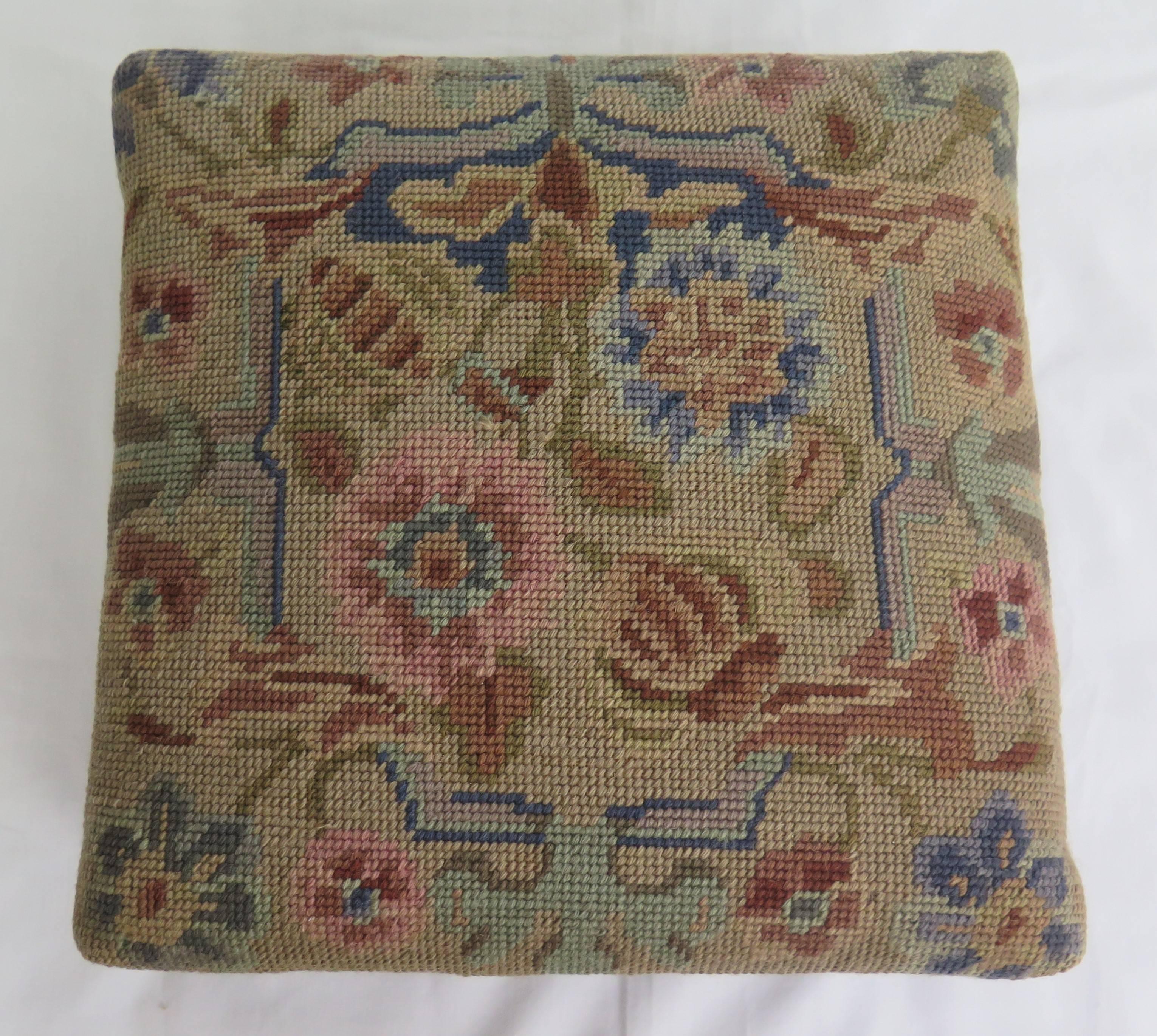 This is a good example of an English foot stool with a tapestry top dating to the late 19th century of the Victorian period.

The stool has a square shaped oak frame sitting on four turned oak bun feet. The top is upholstered in a hand-stitched