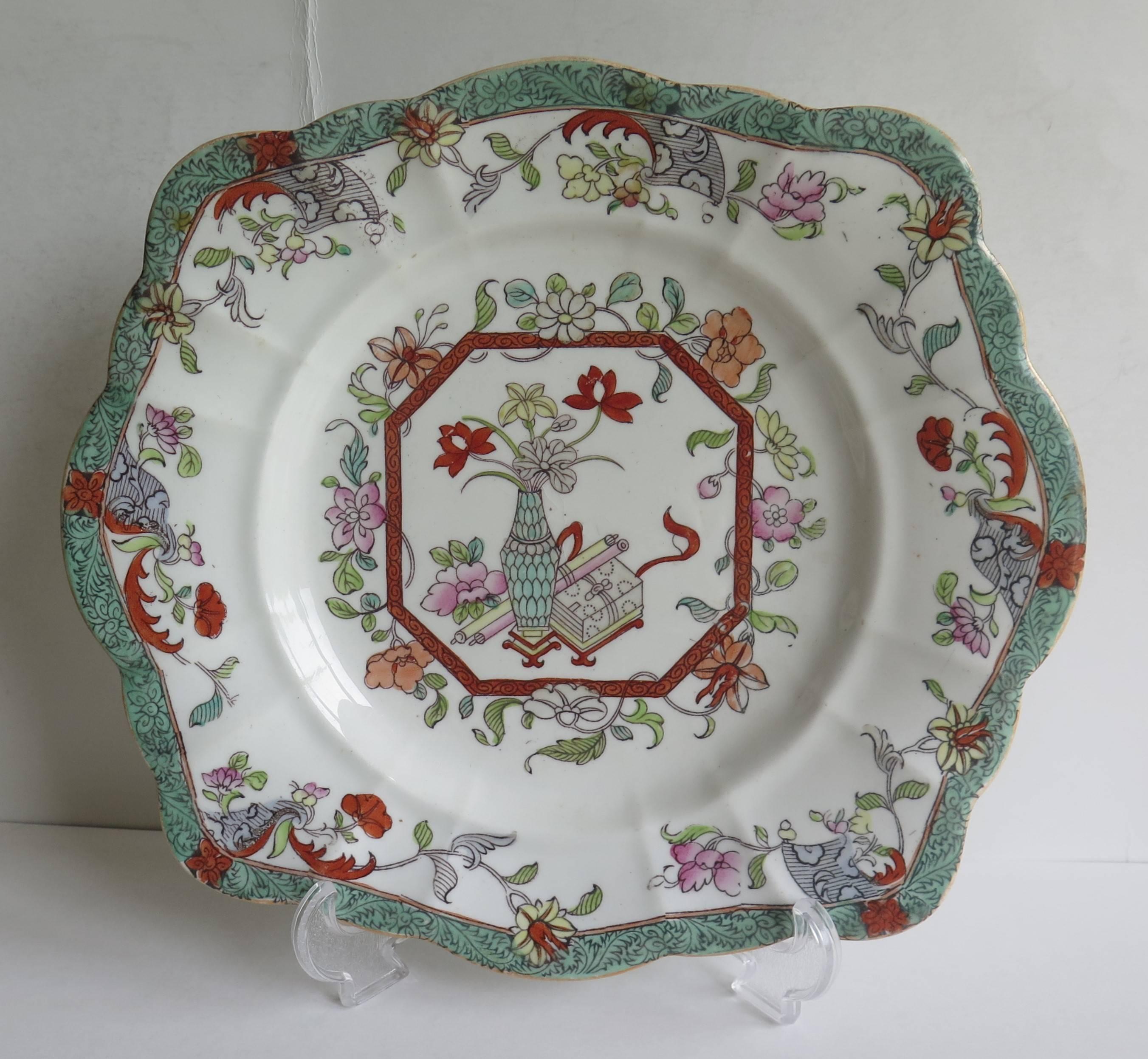 This is a sandwich dish or plate by Mason's Ironstone, England, dating to the first half of the 19th Century, Circa 1940.

These dishes are fairly rare, having a moulded and slightly fluted square shape.

This dish is decorated in the Vase and Box