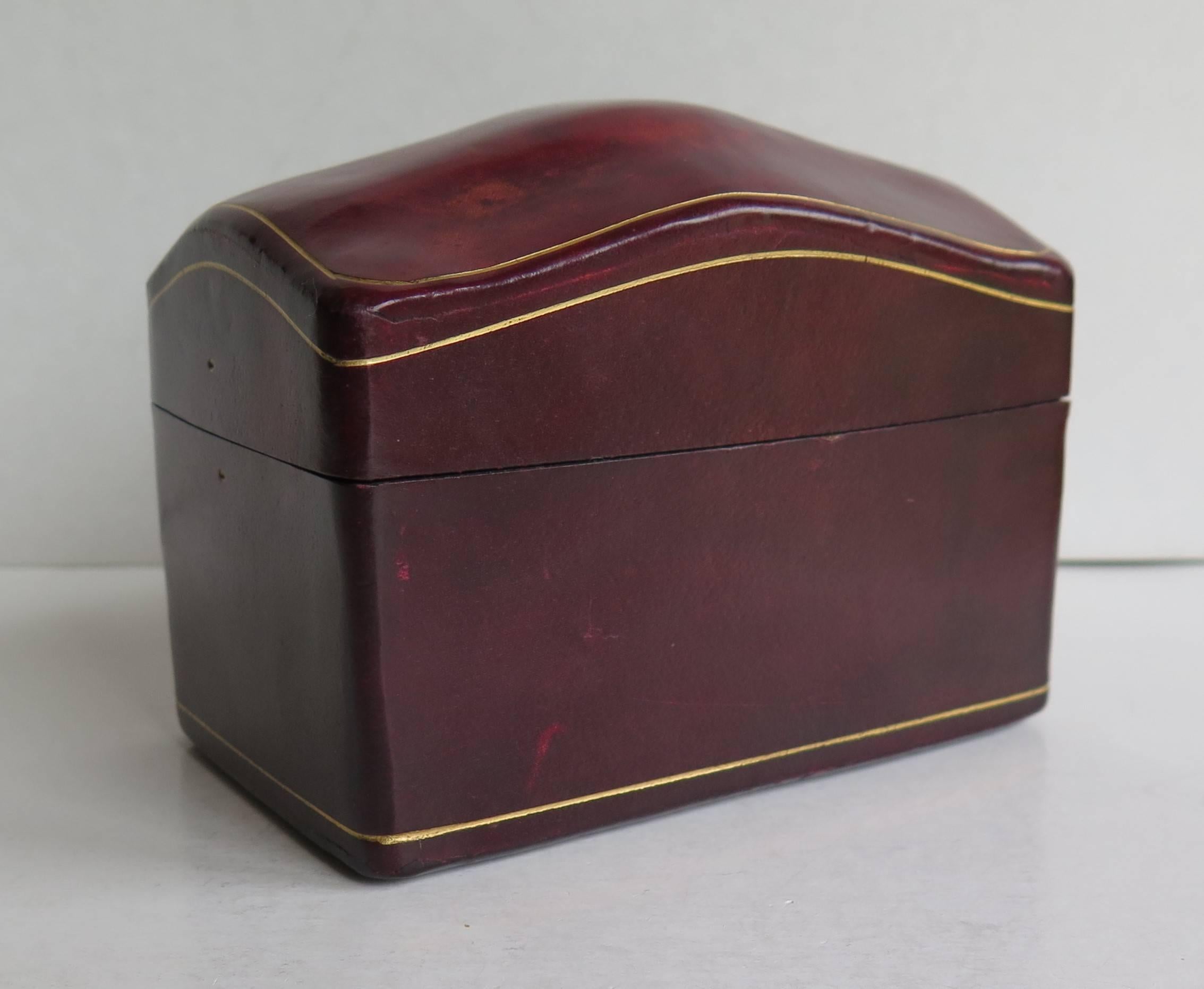 This is a high quality, hand made, Calf Leather Lidded Box to hold two sets of playing cards, made in Italy in the mid 20th Century.

The hand tooled box is rectangular in shape with a domed lid. Internally the box has two compartments to house two