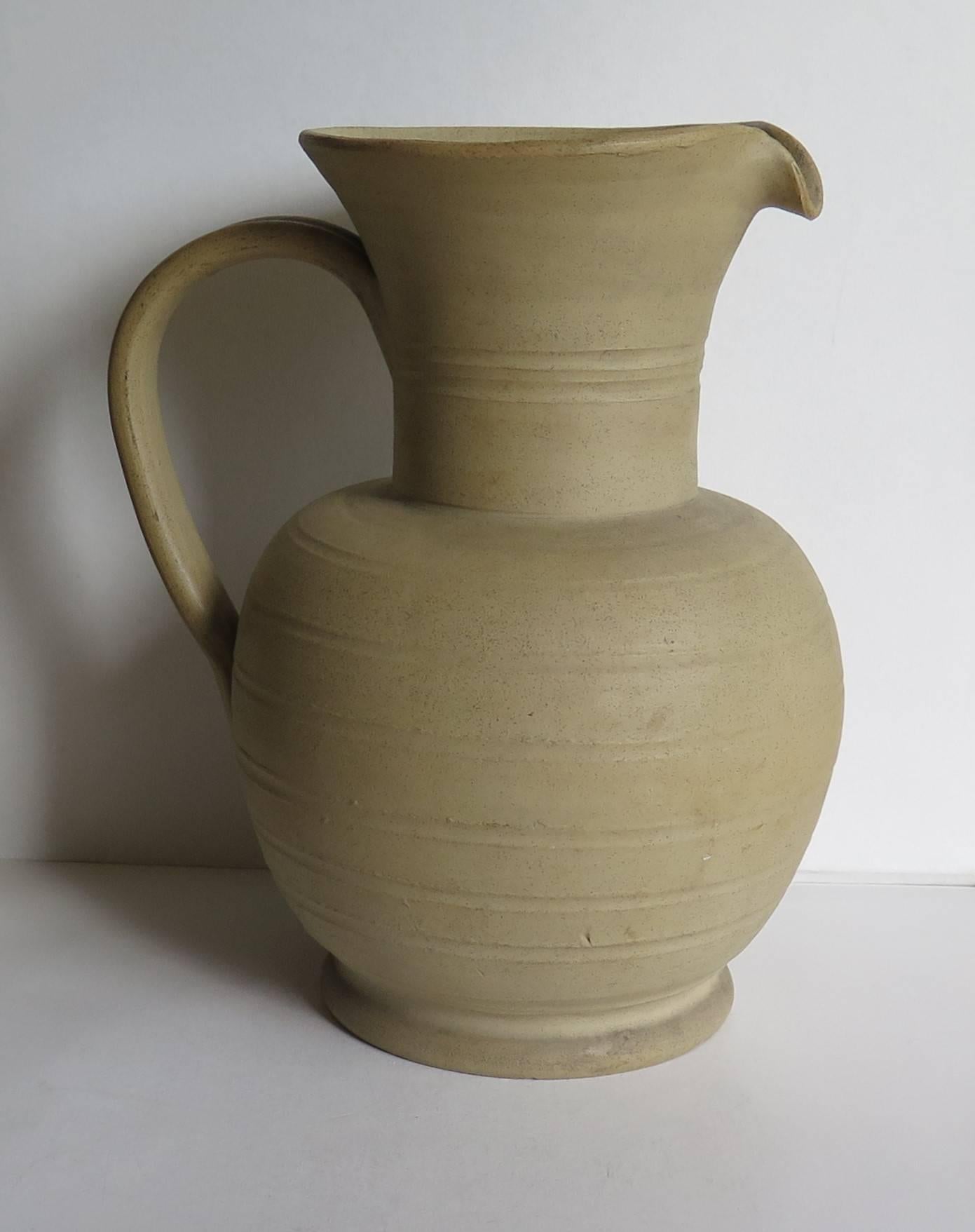 This large stoneware jug was manufactured by the Moira Pottery Company, near Burton on Trent, Leicestershire in England. The Moira Pottery works was founded in 1922 and demolished in the 1970s.

This hand potted stoneware jug or pitcher has a