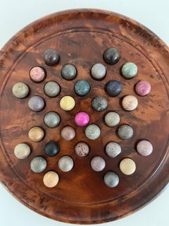 Marble Solitaire Board Game with 33 Handmade 19th Century Clay or Stone Marbles.