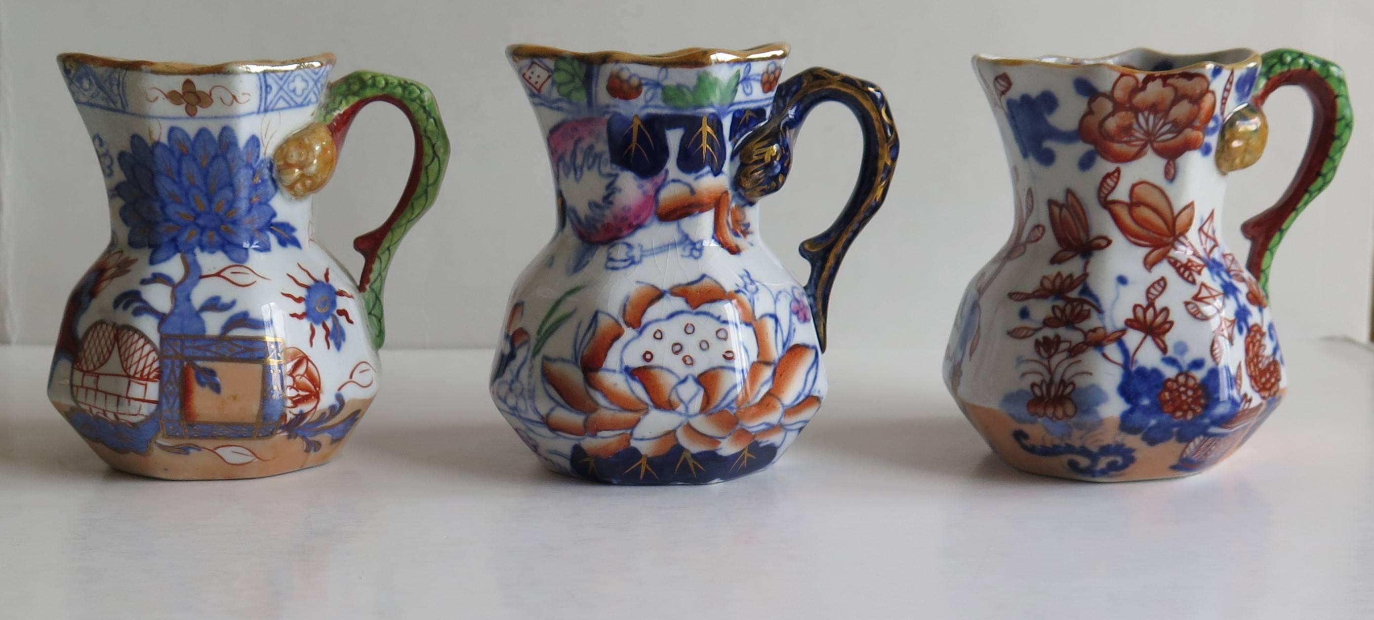 This is a harlequin set of three small Mason's Ironstone jugs or pitchers, all dating to the mid 19th Century.

Very small Mason's jugs or pitchers tend to be rare.

These jugs have the octagonal Hydra shape with a snake handle, all dating to the
