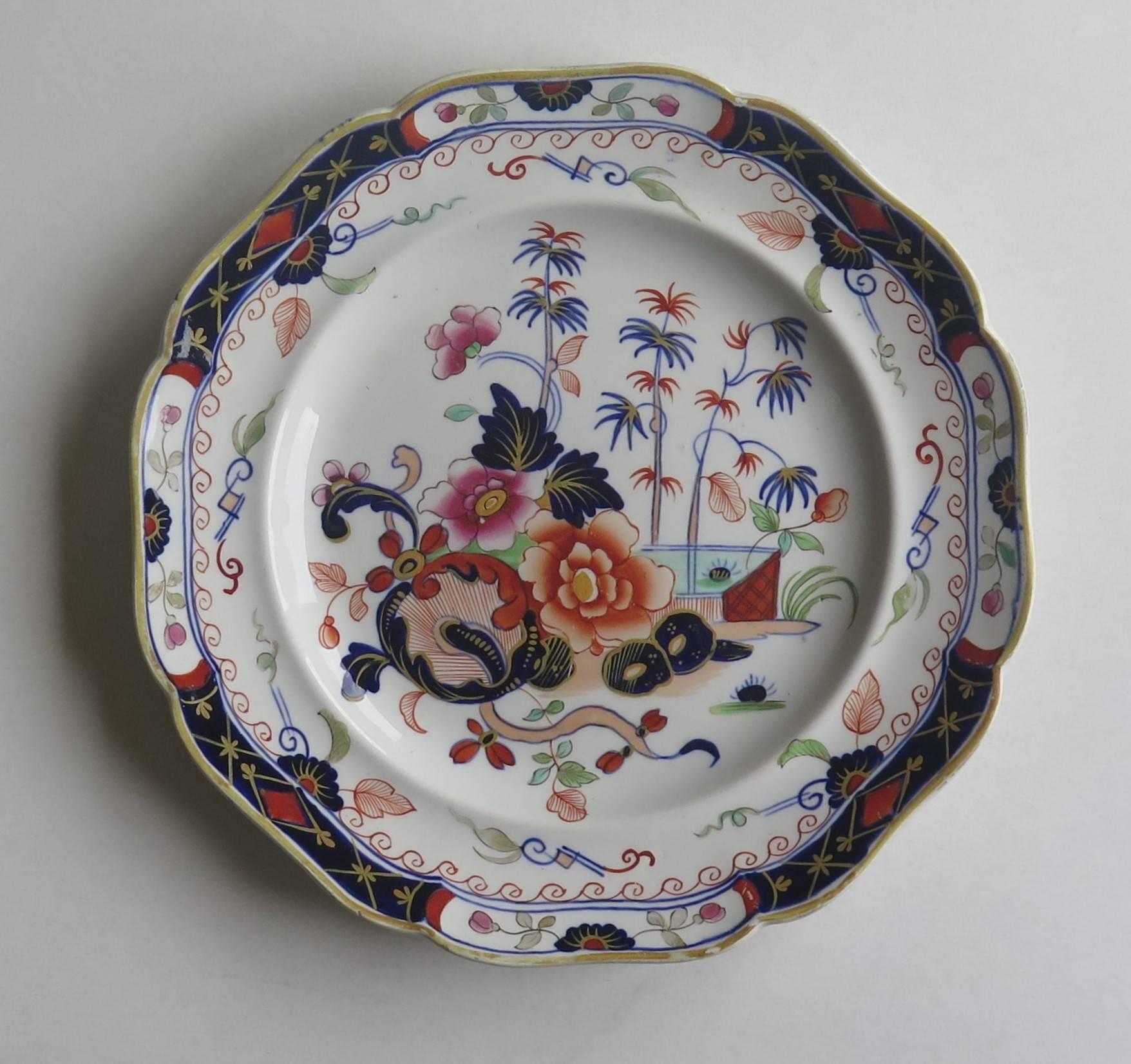 This is a highly decorative, superior stone China (ironstone), plate by John Ridgway, dating to the William IVth period of the 19th century.

The plate has been carefully hand-painted in bold colorful enamels with a central Chinoiserie pattern with
