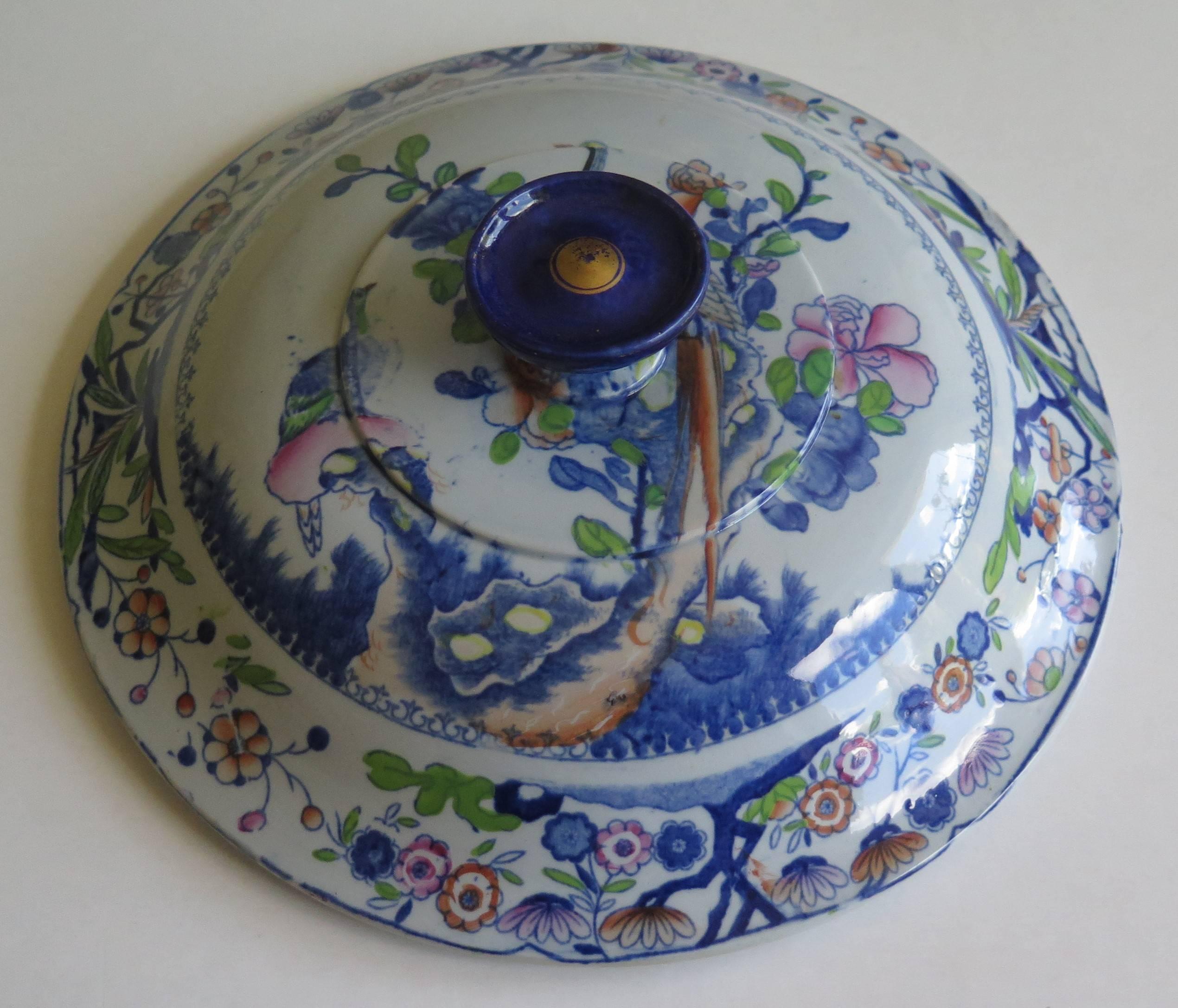 This is a very decorative large tureen lid made by Mason's Ironstone in the early 19th century.

The lid is beautifully decorated in the Oriental Pheasant pattern which is one of Mason's chinoiserie patterns, showing a central long tailed pheasant