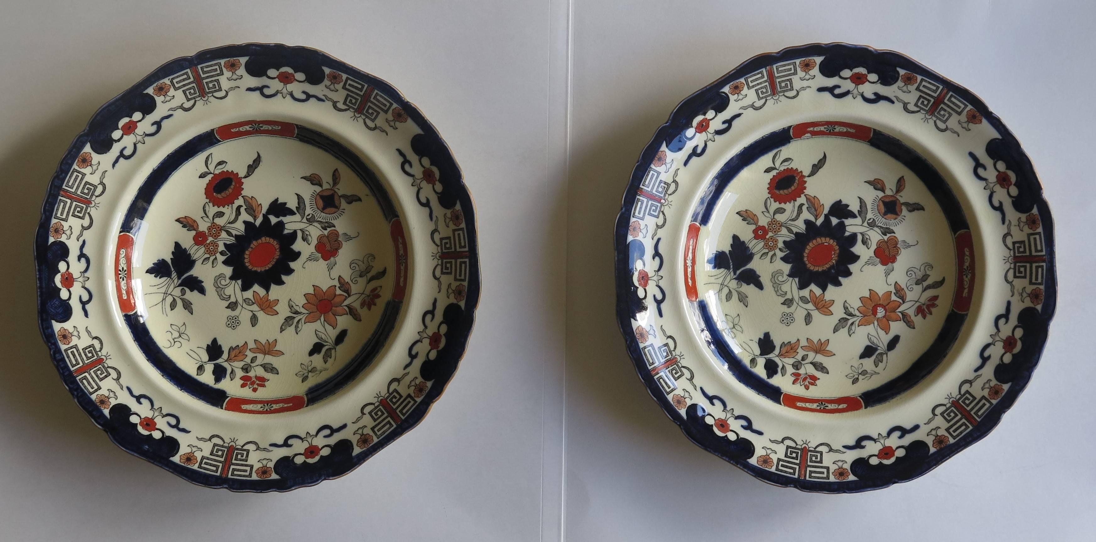These are a good and very decorative pair of ironstone bowls or plates made by Mason's ironstone, Staffordshire, England. 

The plates are boldly decorated in the Daisy pattern, which is illustrated on page 57 of A Guide to Mason's Patent Ironstone